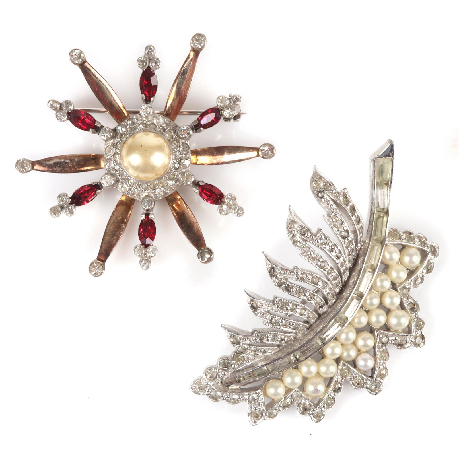 Two Retro pins: Mazer sterling starburst and Jomaz: Two Retro pins: Mazer sterling starburst and Jomaz leaf. Mazer sterling silver flower with ruby marquise crystals, pave, faux pearl center, tipped in rhinestones and Jomaz diamante leaf brooch with pa