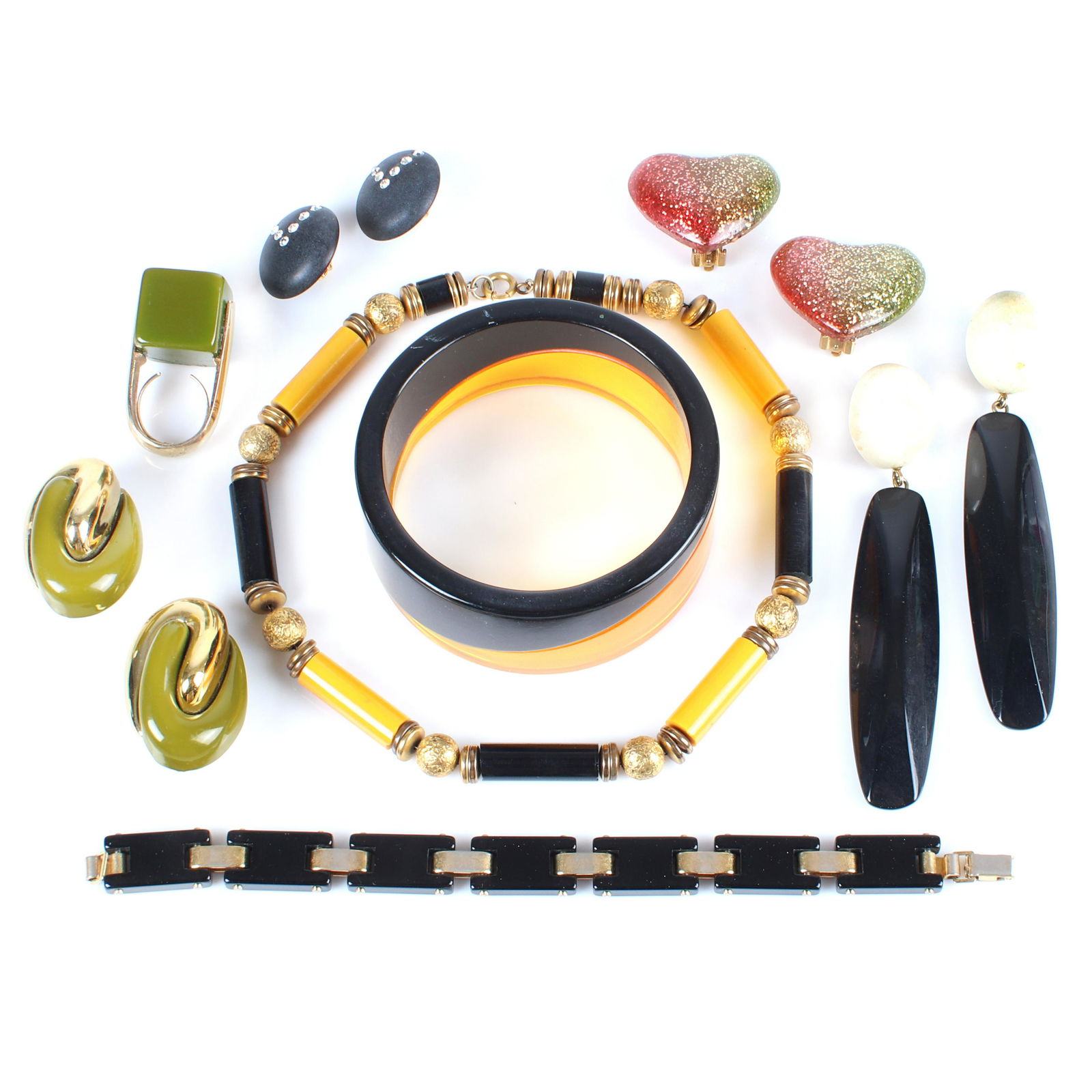 Festive vintage Designer plastic and Bakelite costume: Festive vintage Designer plastic and Bakelite costume jewelry group: asymmetrical 2 color bangle bracelet, beaded necklace with brass beads, Guy Laroche linked black and gold tone bracelet, green Bake