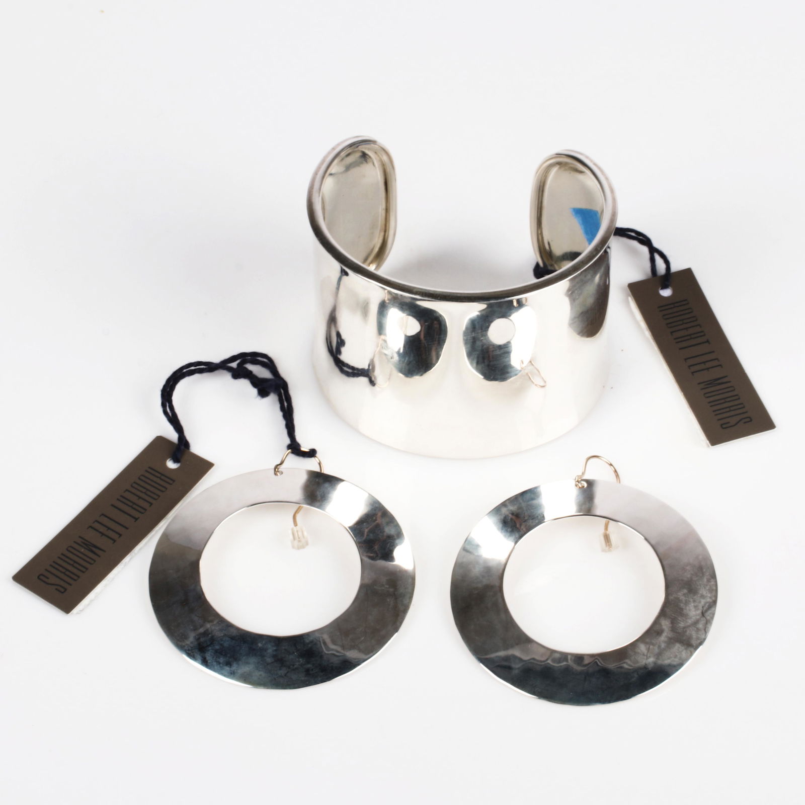 Robert Lee Morris RLM designer "Classic Collection" 2"W: Robert Lee Morris RLM designer "Classic Collection" 2"W sterling silver cuff bracelet and 2 1/4"diam. sterling silver "Wide Closed Hoop," new old stock with original tags, marked RLM Sterling. Robert