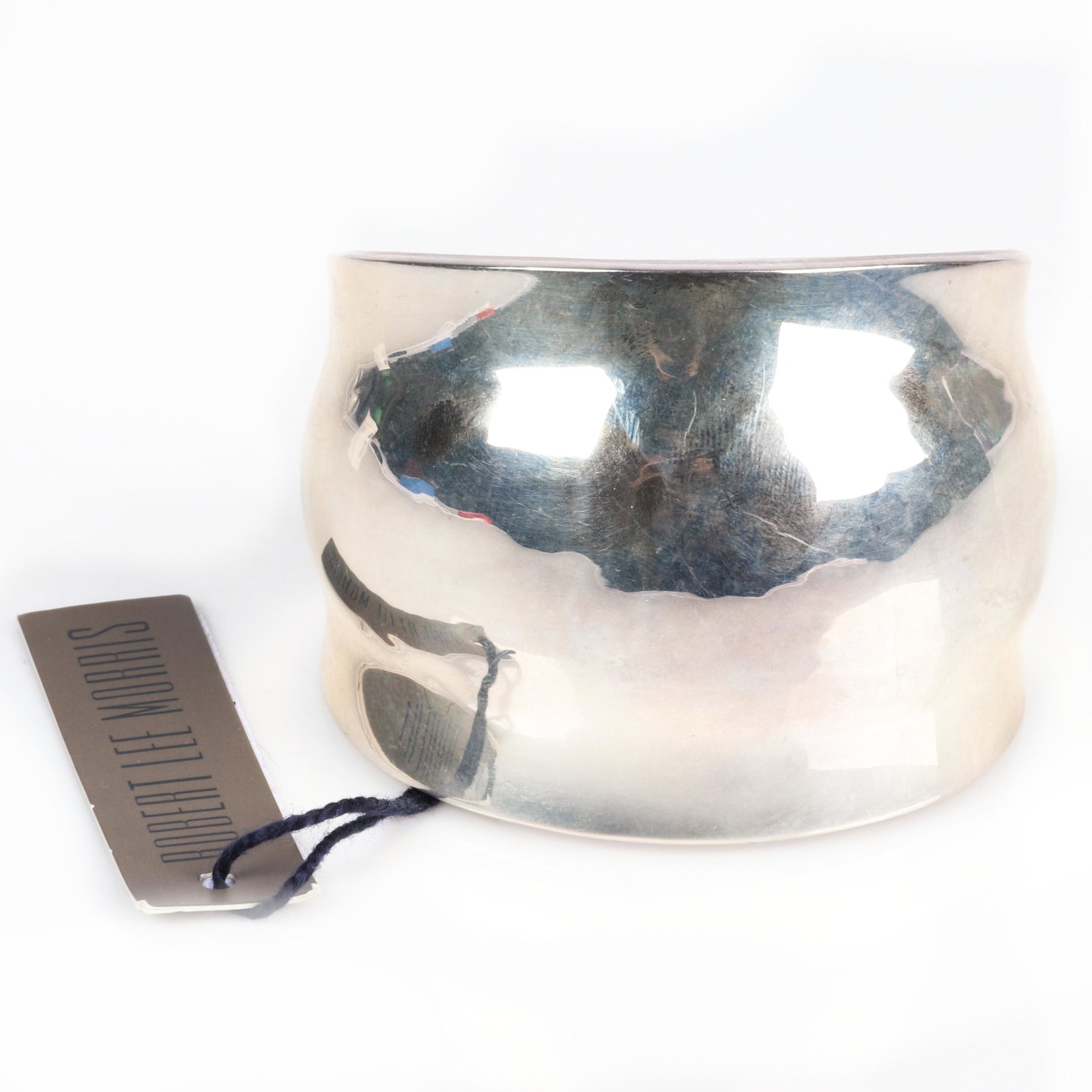 Robert Lee Morris RLM designer 2 3/4"W sterling silver: Robert Lee Morris RLM designer 2 3/4"W sterling silver asymmetrical "Wave" cuff bracelet, new old stock with original tags, marked RLM Sterling. Robert Lee Morris (born 1947) is an American jewelry de