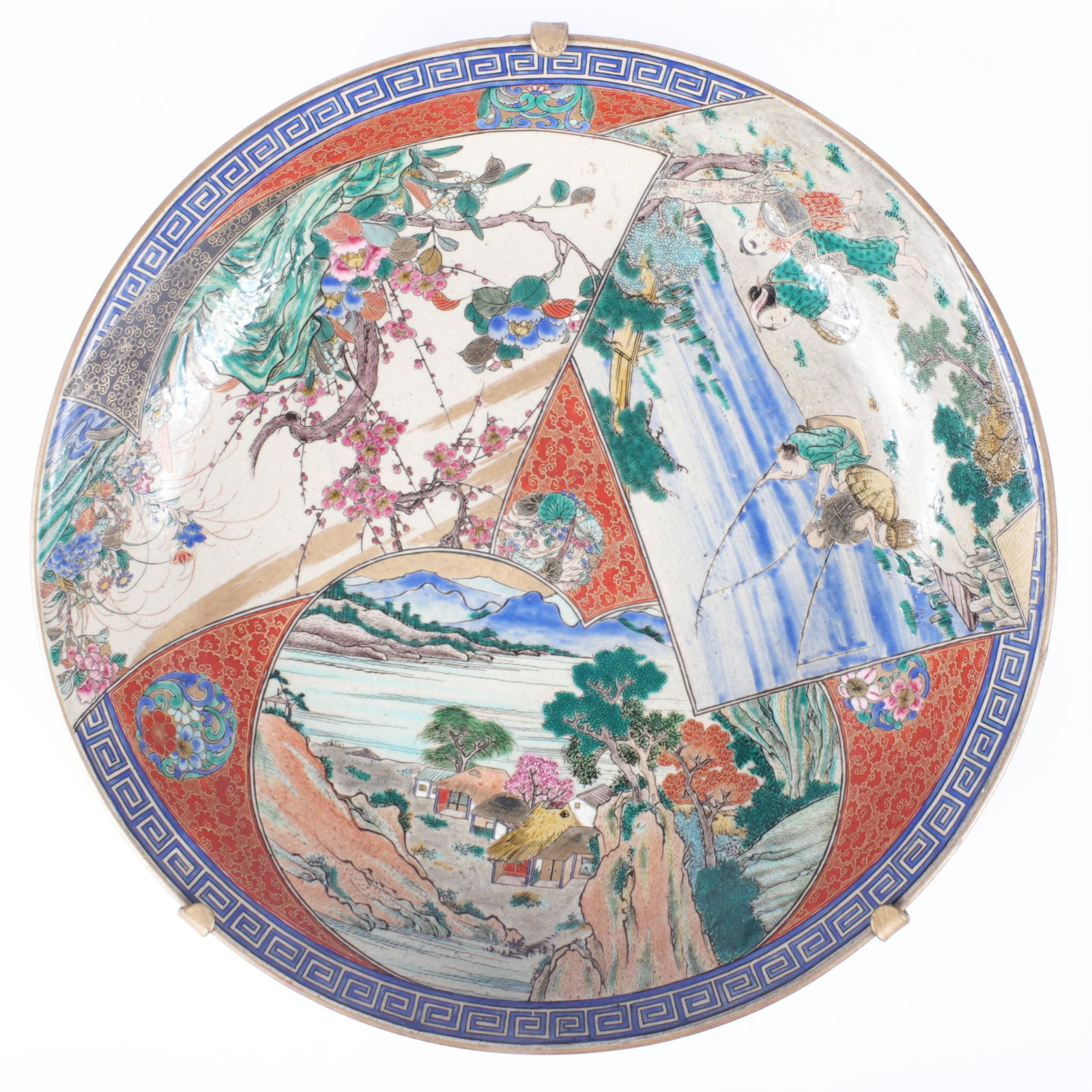 Large 19th Century Japanese Satsuma stoneware charger: Large 19th Century Japanese Satsuma stoneware charger plate with aesthetic village and fishing panel scenes. 2 3/4"H x 14 1/2"diam.