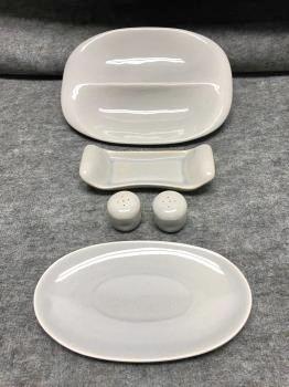 Russel Wright Gray American Modern five pieces: 5" x: Russel Wright Gray American Modern five pieces: Divided Vegetable Dish; Oval pickle/underliner; Salt & pepper shakers; Butter dish base-two chips to rim, stained, crazed. 5" x 10" (vegetable dish)
