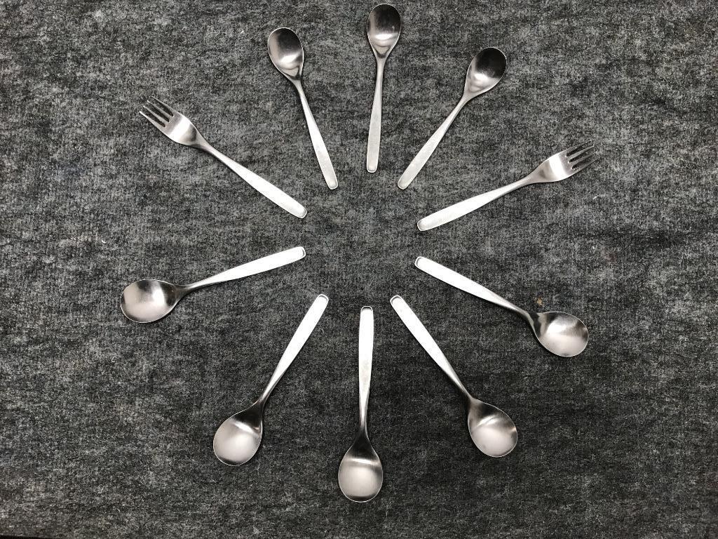 Russel Wright Ten Pieces Hull Stainless Pinch Flatware:: Russel Wright Ten Pieces Hull Stainless Pinch Flatware: Two Dinner Forks; Three Teaspoons; Five Soup Spoons. Some worn places and rust spots. 7 1/4"L