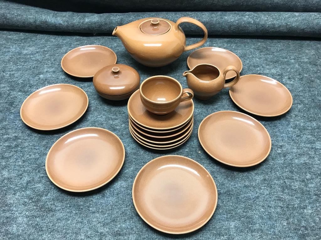 Russel Wright Iroquois Ripe Apricot 19 Pieces: 5 1/2"H: Russel Wright Iroquois Ripe Apricot 19 Pieces: Restyled Teapot; Restyled Creamer; Restyled Covered Sugar; One Restyled Cup; Six Saucers; Six b&b Plates. 5 1/2"H (teapot)