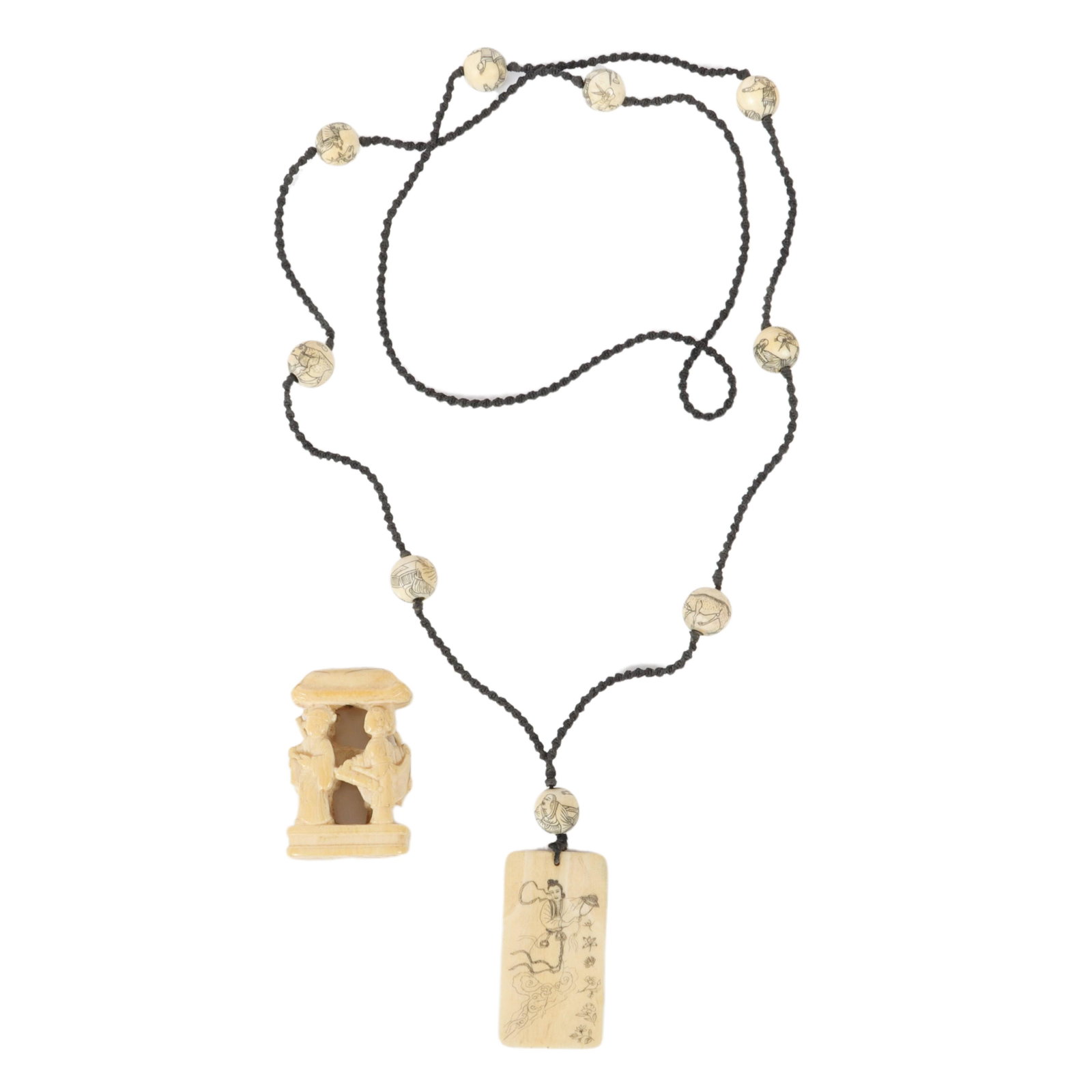 Japanese 2pc carved bone: netsuke with four figures 2"H: Japanese 2pc carved bone: netsuke with four figures and carved and inked bone design beads and pendant on black cording. 2"H x 1 1/4"W (netsuke)