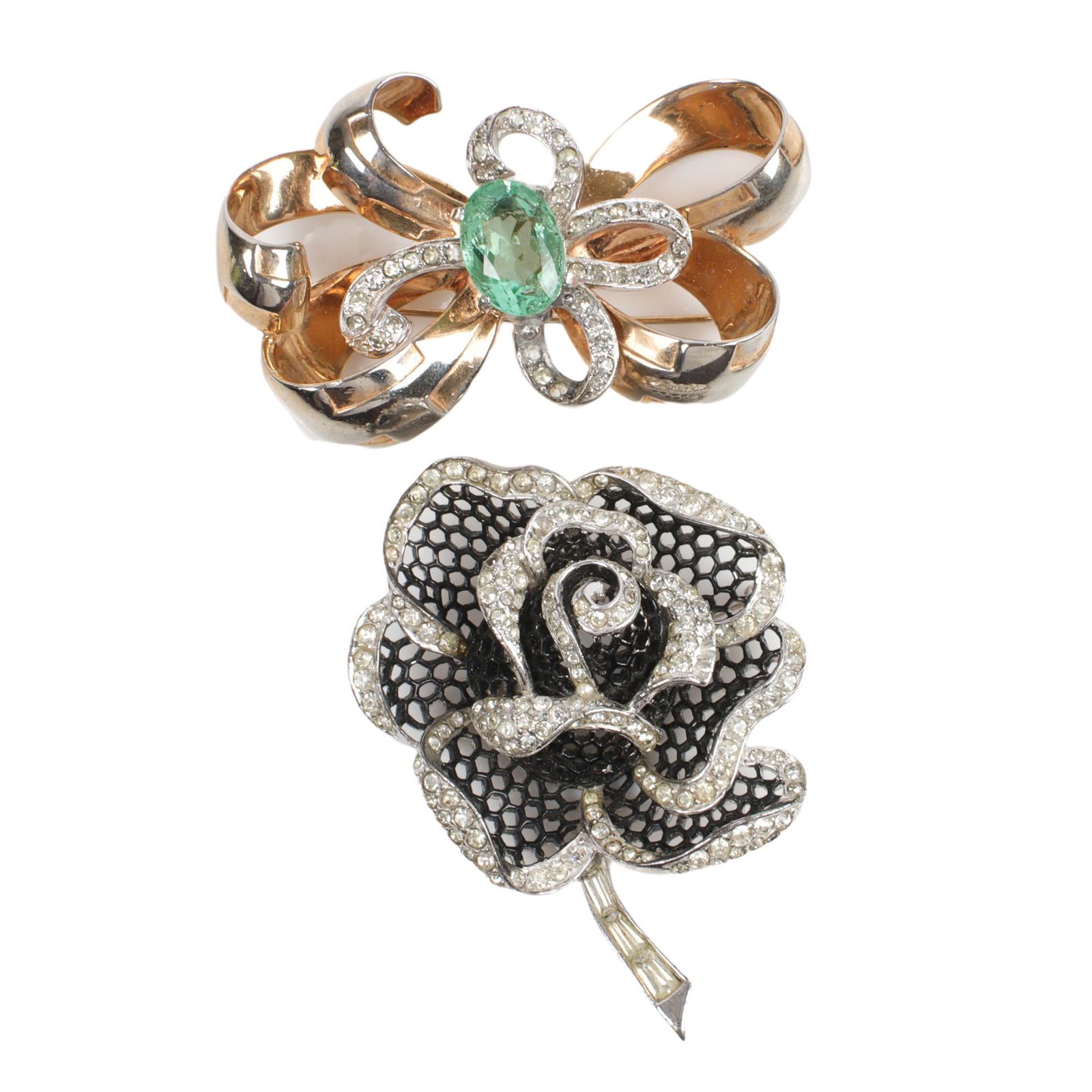 Two vintage pins: Boucher black "mesh" tipped in rhinestones and Mazer ribbon 2 1/2"H x 1 3/4"W: Two vintage pins: Boucher black "mesh" tipped in rhinestones and Mazer ribbon with huge green central crystal and curling ribbons of rhinestones. 2 1/2"H x 1 3/4"W (largest)