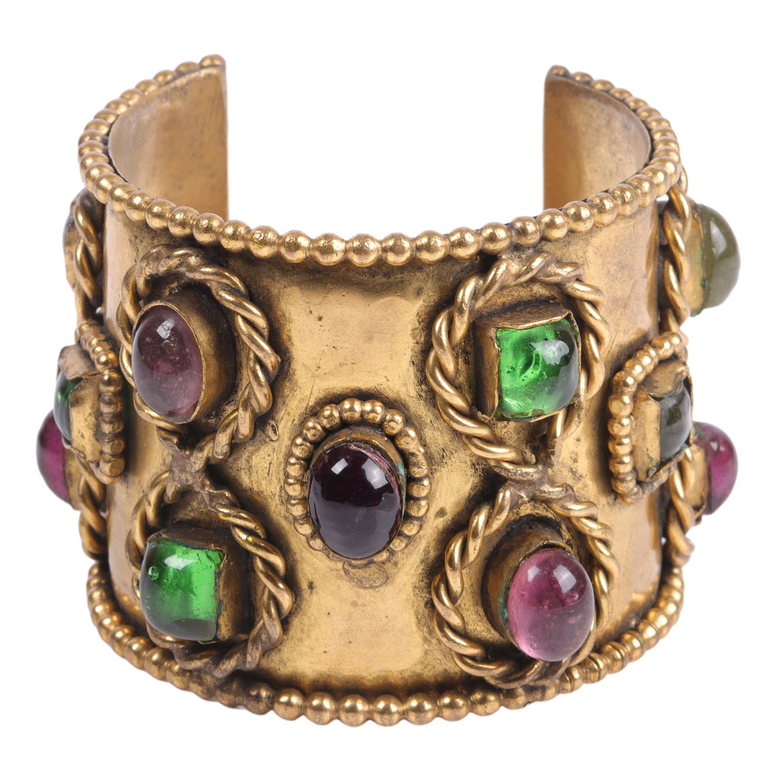 Isabel Canovas couture designer wide brass cuff bracelet with green and purple glass cabochon jewels: Isabel Canovas couture designer wide brass cuff bracelet with green and purple glass cabochon jewels and twisted rope and beaded metal trim. From the collection of Connie DeNave, Jeweldiva. 2 3/8"inne