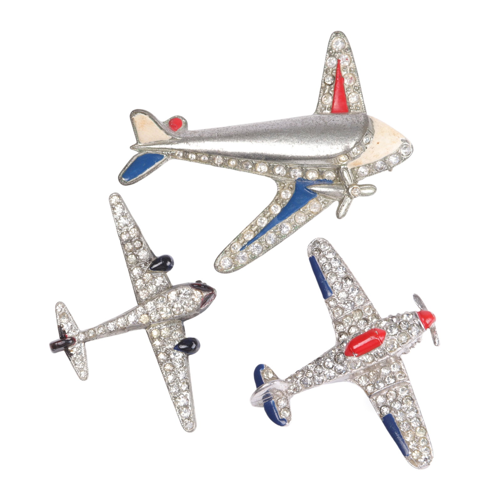 Three vintage Patriotic costume jewelry airplane pins including Trifari with red & blue enamel and: Three vintage Patriotic costume jewelry airplane pins including Trifari with red & blue enamel and pave 2"H x 2 1/4"W (largest)