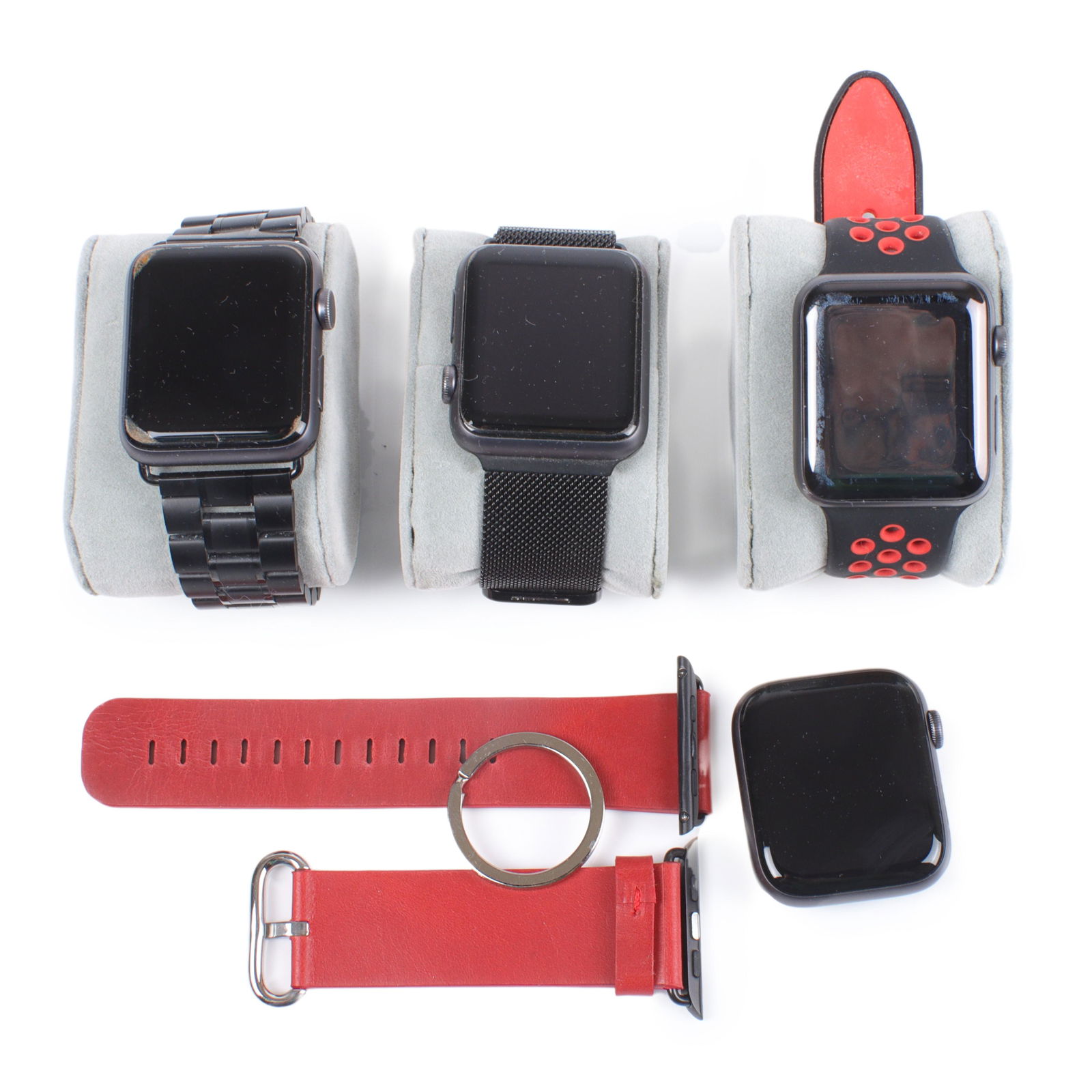 Four Apple Watches and bands: three series 3 & one series 4, portable Apple watch charger (1 of 8)