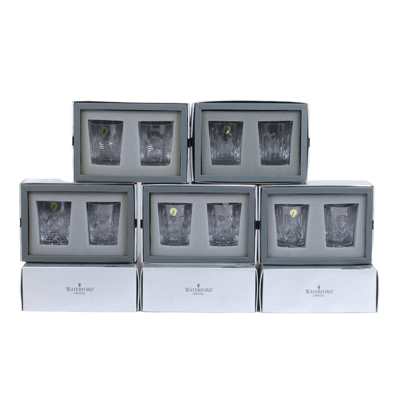 Sixteen Waterford Millennium Collection Toasting double old fashion crystal glasses, 4 3/8"H x 3: Sixteen Waterford Millennium Collection Toasting double old fashion crystal glasses in orignal boxes (eight boxes, 16 glasses). 4 3/8"H x 3 1/2"diam. (each)