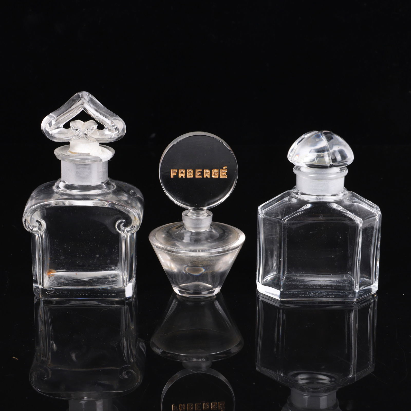 Three Art Deco Baccarat French crystal perfume bottles: two Guerlain scent bottles and one Faberge: Three Art Deco Baccarat French crystal perfume bottles: two Guerlain scent bottles and one Faberge scent bottle 4 1/2"H x 2 5/8"W (largest)