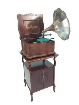 Regina Reginaphone disc Music Box / Phonograph with combination horn and turntable on cabinet stand,: Regina Reginaphone disc Music Box / Phonograph with combination horn and turntable on cabinet stand, dated 1889-1892. Serial number 1500949. Includes winder. Plays 15 1/2" disks. No broken teeth. Over