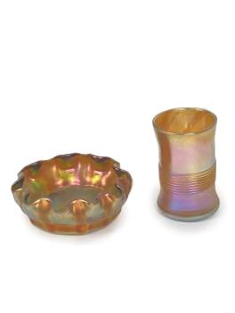 Two Louis Comfort Tiffany iridescent gold favrile glass vessels, ca 1900, 3/4"H x 2 1/2"Diam.: Two Louis Comfort Tiffany iridescent gold favrile glass vessels, ca 1900 both inscribed L.C.T. under base. Individual salt cellar with ruffle rim, and toothpick holder with threaded detail, inscribed