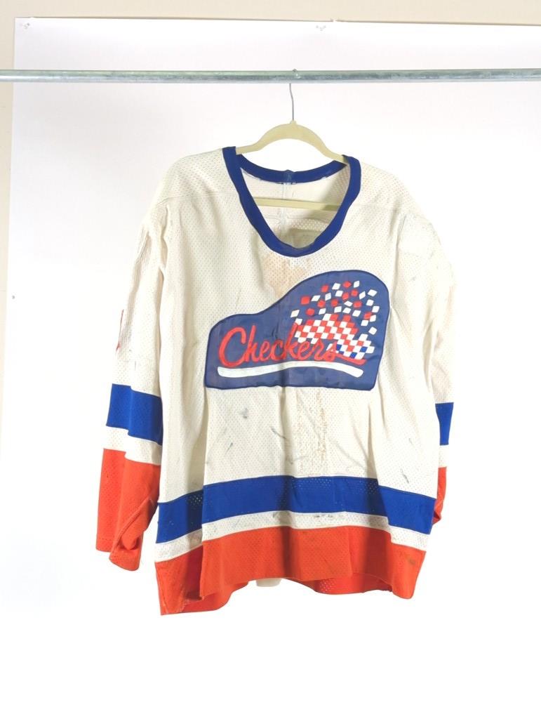1985-86 Indianapolis Checkers Jim Koudys Game Used Hockey Jersey: 1985-86 Indianapolis Checkers Jim Koudys Game Used Hockey Jersey Koudys played in 32 games during the year 4 goals and scored and 13 assists. The jersey shows good use.
