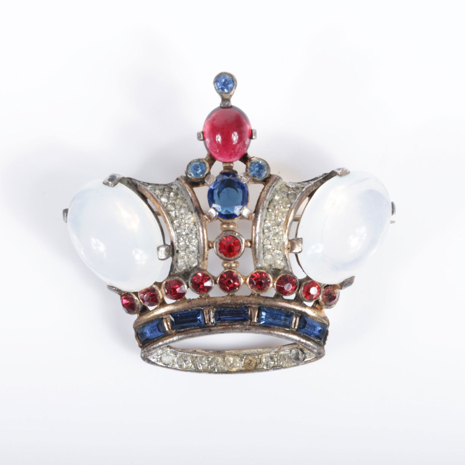 Trifari Alfred Philippe sterling vermeil Coronation King Crown Jelly Belly pin brooch with: Trifari Alfred Philippe sterling vermeil Coronation King Crown Jelly Belly pin brooch with moonstone, sapphire and ruby red color jewels, 1944. 1 3/4"L x 2"W