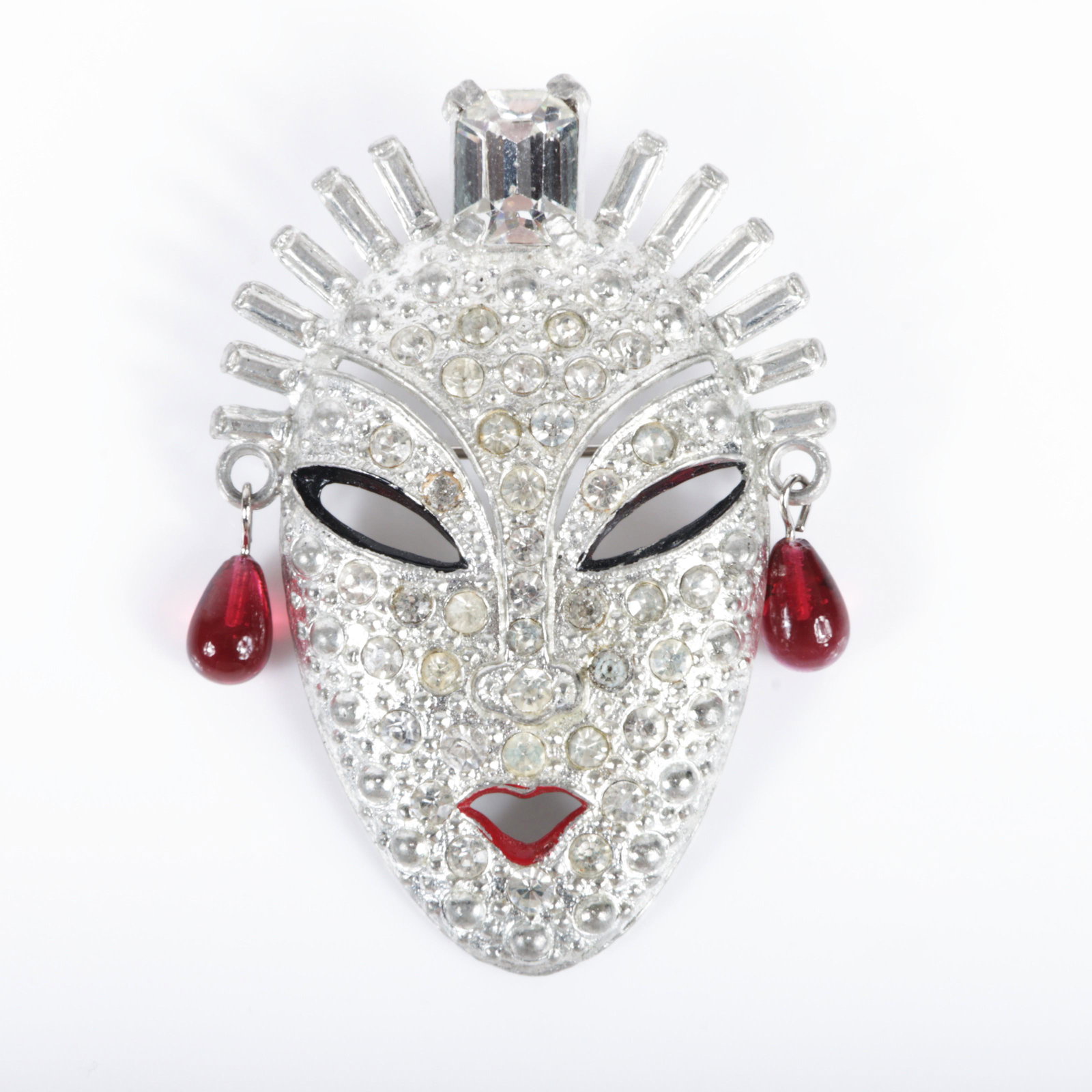 Vintage art deco unsigned Mazer? pave face mask pin with emerald cut crystal diamante head piece,: Vintage art deco unsigned Mazer? pave face mask pin with emerald cut crystal diamante head piece, enamel, & red glass tear drop dangle earrings, rhodium plated. 2 1/4"H x 1 3/4"W x 1/4"D