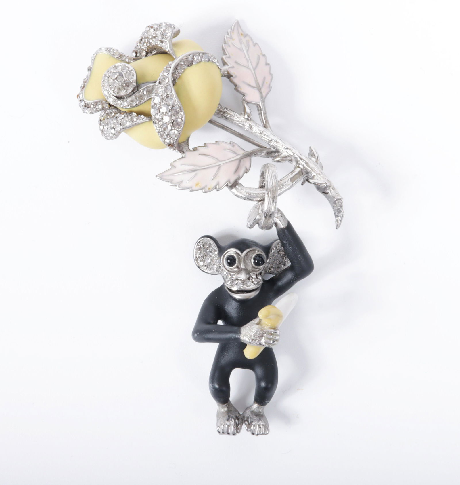 Ciner Patch NYC yellow rose pin brooch with dangling figural monkey holding a banana 3 1/2"H x 1: Ciner Patch NYC yellow rose pin brooch with dangling figural monkey holding a banana accented with pave rhinestones and matte enamel details 3 1/2"H x 1 5/8"W