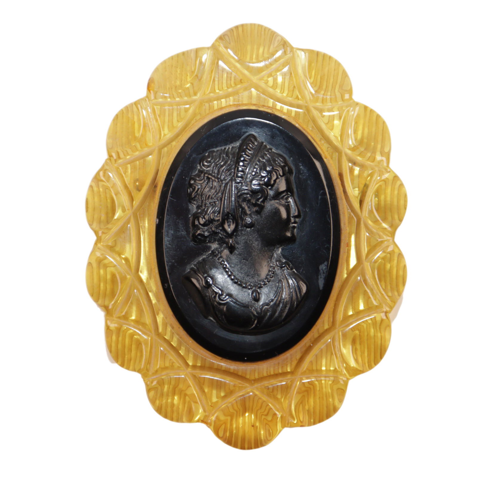 Large carved applejuice Bakelite brooch with black applied cameo. 3 1/8"H x 2 3/8"W (1 of 3)