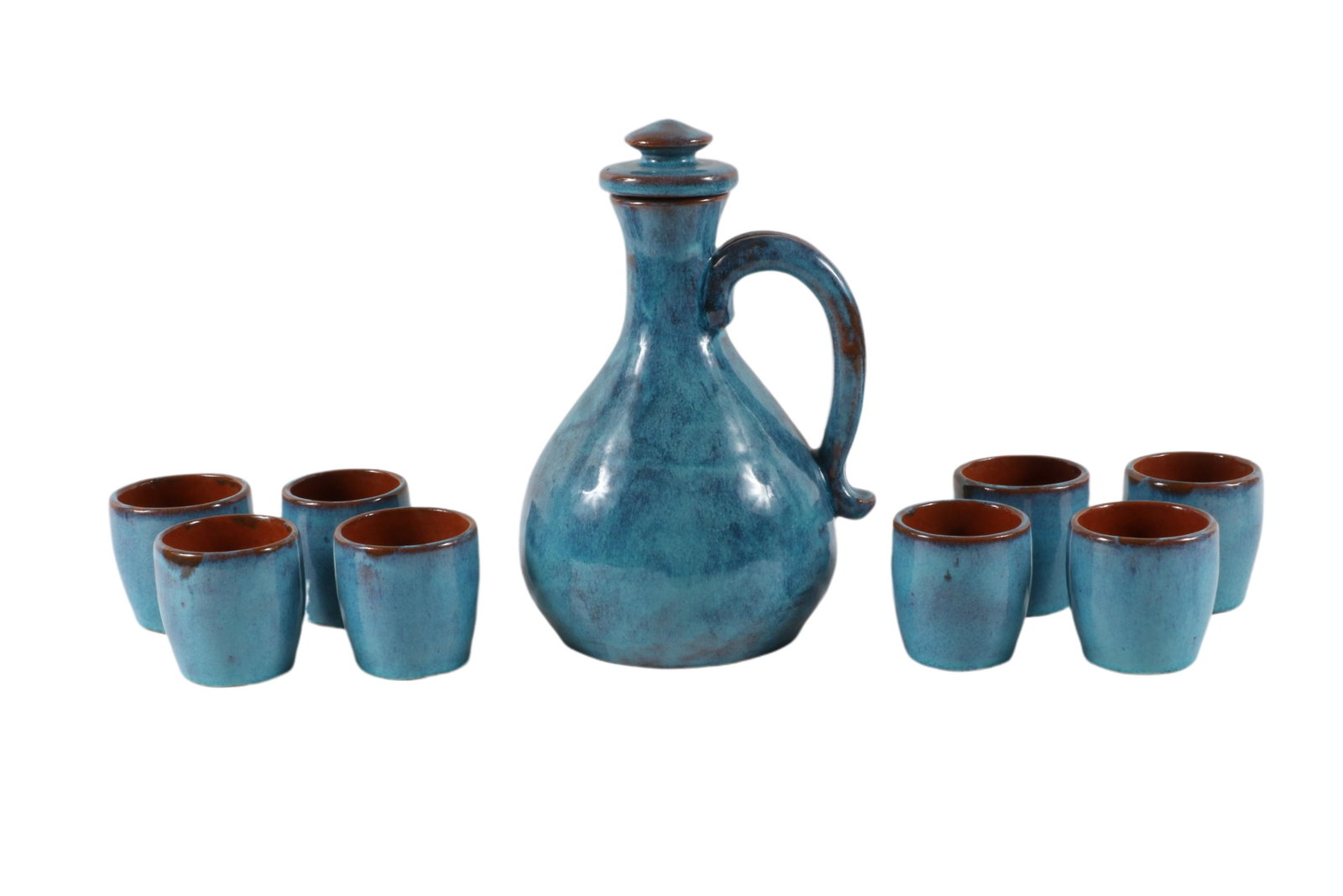 Brown County Hills Art Pottery Wine Set: Brown County Hills Art Pottery Wine Set 8 3/4” T x 5 1/2” D handled carafe w/stopper; 8 2 1/2” T x 2 1/2” D wine cups; gloss blue glaze over red clay; each signed â€œ Brown