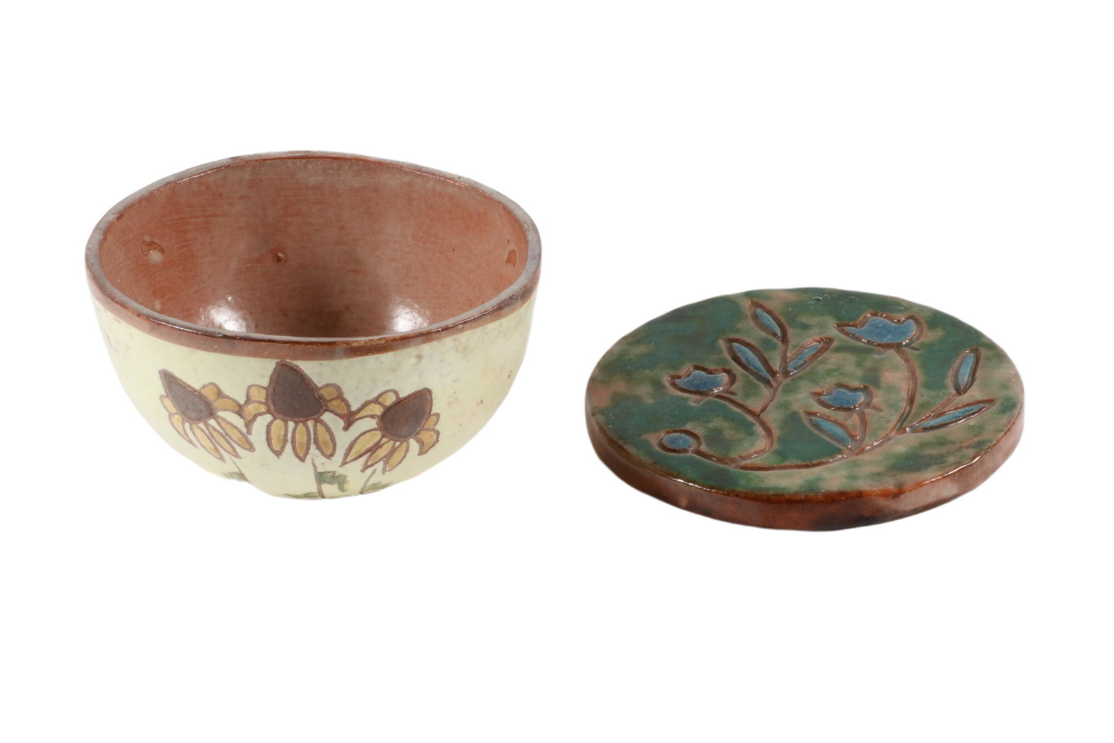 Two pieces of Brown County Pottery, 2 1/2â€ T x 4 3/4â€ D Bowl; high gloss glaze Brown eyed Susan: Two pieces of Brown County Pottery 2 1/2” T x 4 3/4” D Bowl; high gloss glaze Brown eyed Susan floral decoration over red clay; signed â€œBCP.” 1/2” T x 4 3/4” D Tea 