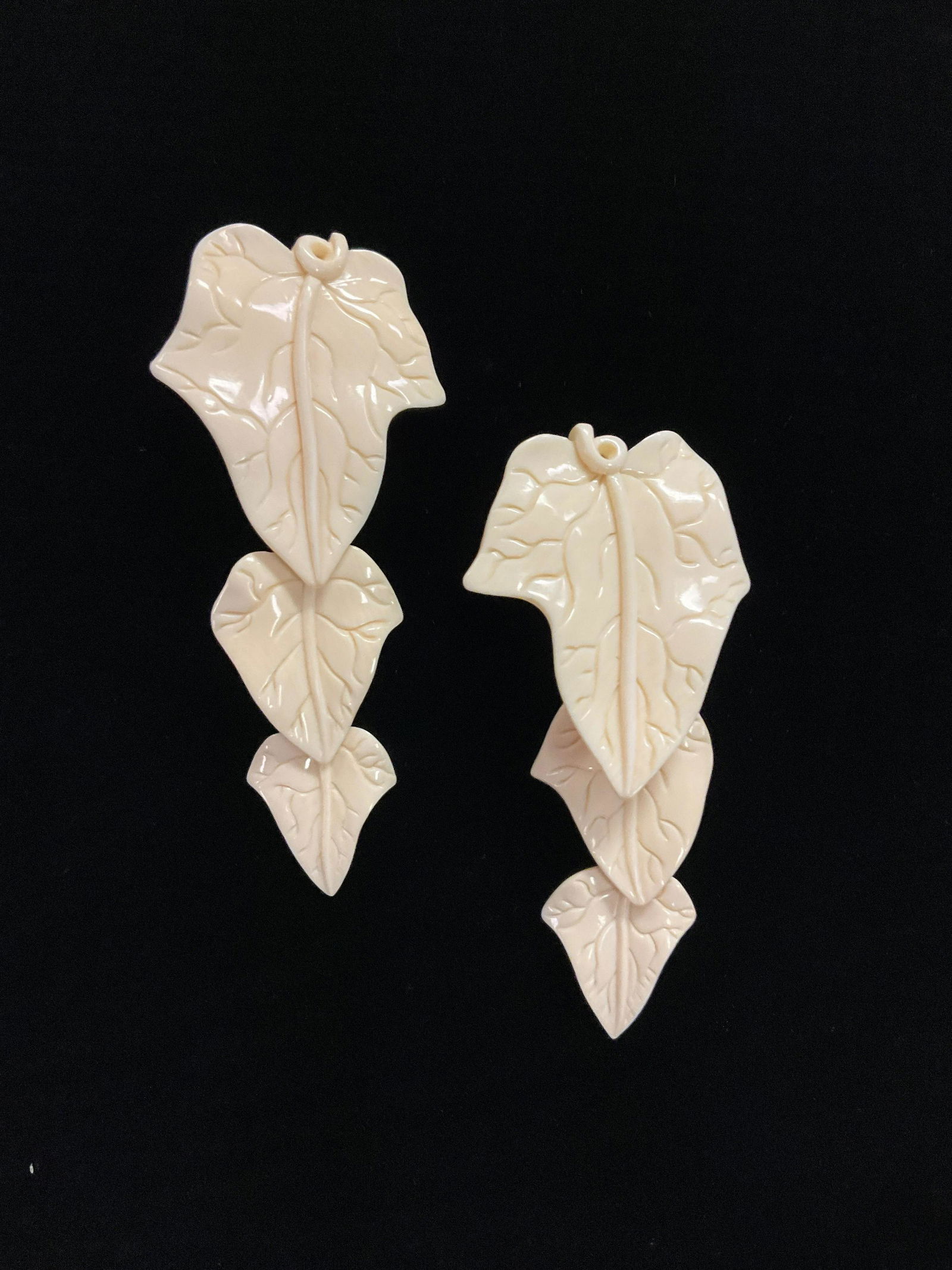Stephen Dweck hand carved bone 3 tier graduated ivy leaf clip on dangle earrings, 3 1/2"H x 1 1/2"W: Stephen Dweck hand carved bone 3 tier graduated ivy leaf clip on dangle earrings, with original tag; 1 link is damaged. 3 1/2"H x 1 1/2"W