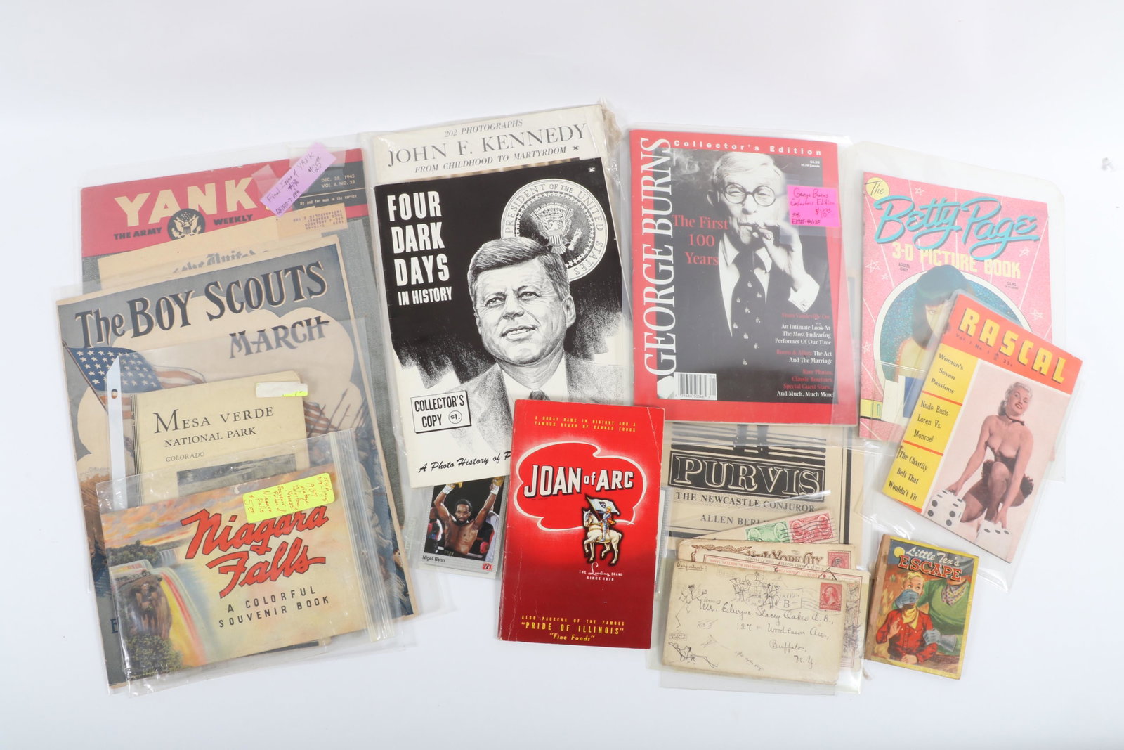 Lot of ephemera: including Niagara Falls souvenir book, Mesa Verde National Park brochure, 14"H x: Lot of ephemera: including Niagara Falls souvenir book, Mesa Verde National Park brochure, Rascal erotic magazine, Betty Page 3-D picture book, Childhood is Hell by Matt Groening, John F. Kennedy: Fro