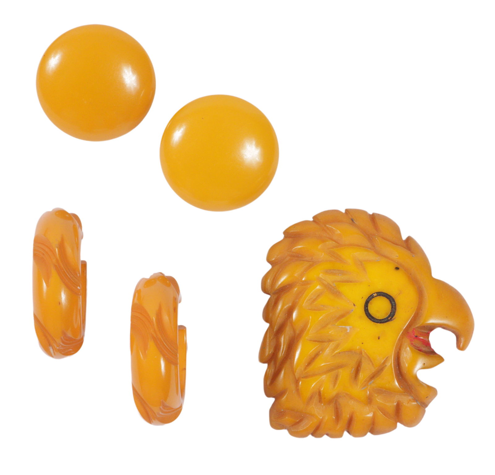Carved butterscotch Bakelite eagle head brooch with two pairs of butterscotch Bakelite earrings.: Carved butterscotch Bakelite eagle head brooch with two pairs of butterscotch Bakelite earrings. 2 1/2"H x 2 1/4"W (bird)