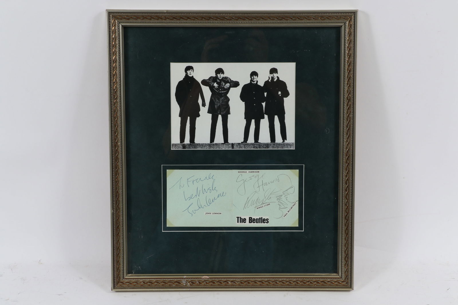The Beatles Signed Framed Autograph Album Pages, PSA/DNA: Autographs of John Lennon which is personalized To Frank on one page, other page includes signatures of Paul McCartney, George Harrison, & Ringo Starr. Framed with a photo of the Fab 4 the piece measu