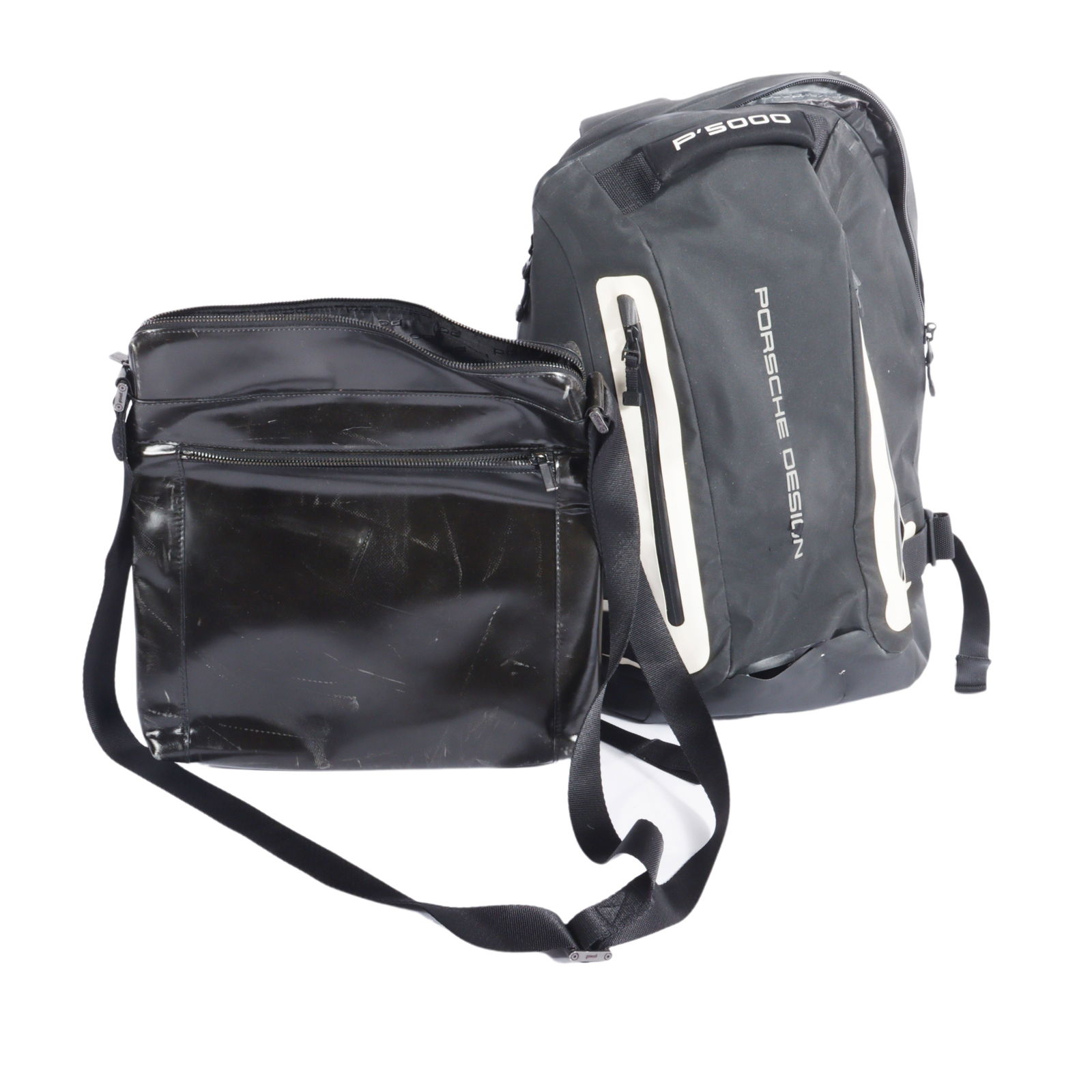 Lot of 2 Porsche Design backpack and crossbody bag 14"H x 13"W (crossbody): Lot of 2 Porsche Design backpack and crossbody bag Backpack has cracking material and a seam near the base has separated. Crossbody bag is scuffed. 14"H x 13"W (crossbody)