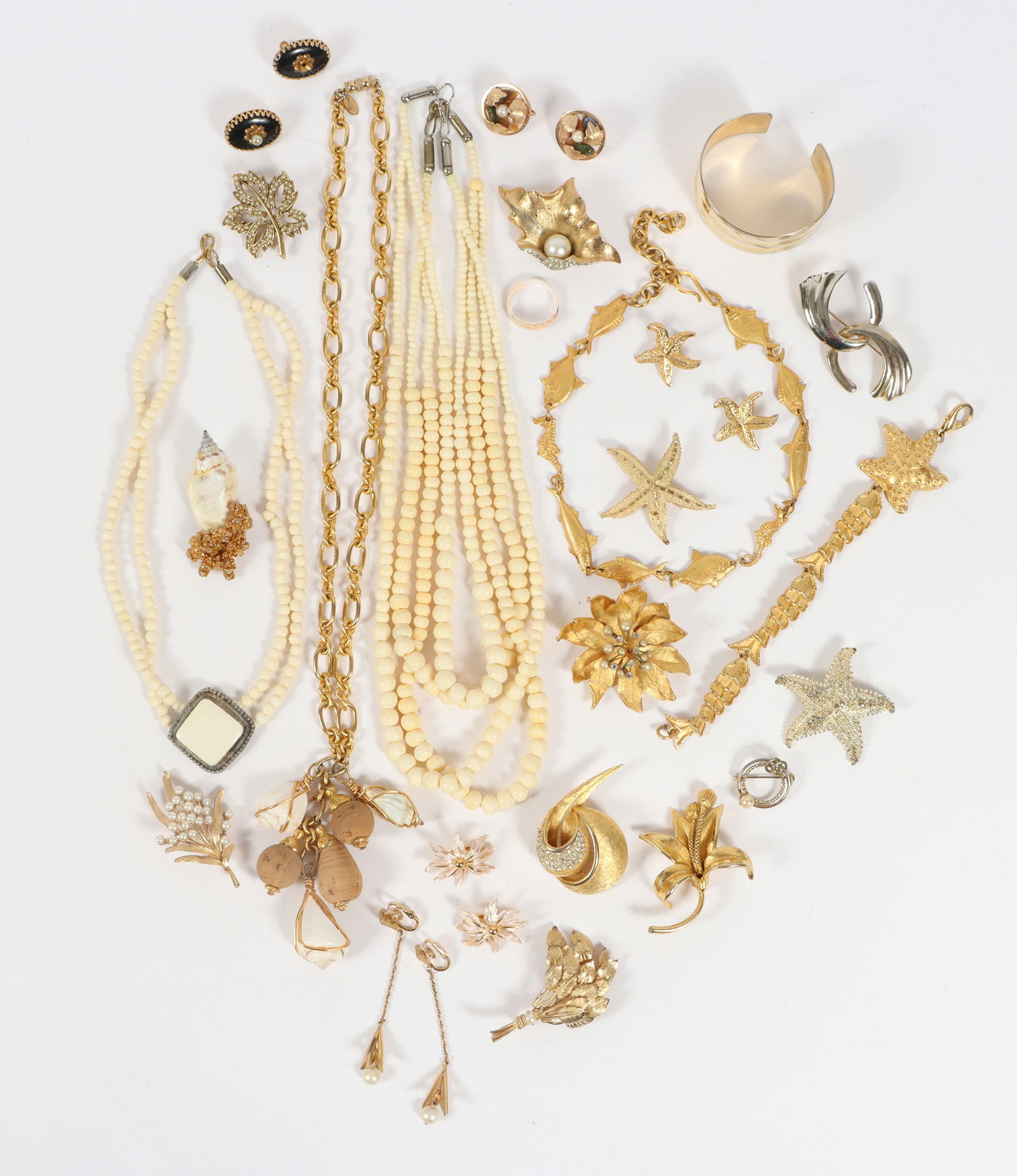 Vintage costume jewelry group including: Hattie Carnegie, Les Bernard, Crown Trifari, Sarah: Vintage costume jewelry group including: Hattie Carnegie, Les Bernard, Crown Trifari, Sarah Coventry, DKNY, ART, Hollywood, BSK, bone necklaces, and more. 24 1/2"L x 2 1/2"W (Les Bernard Necklace)