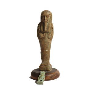 Lot of 2 Egyptian figures: carved stone faience Ushabti and Bes amulet 4 3/4"H x 2 1/8"Diam.: Lot of 2 Egyptian figures: carved stone faience Ushabti and Bes amulet Ushabti has been repaired. 4 3/4"H x 2 1/8"Diam. (largest)