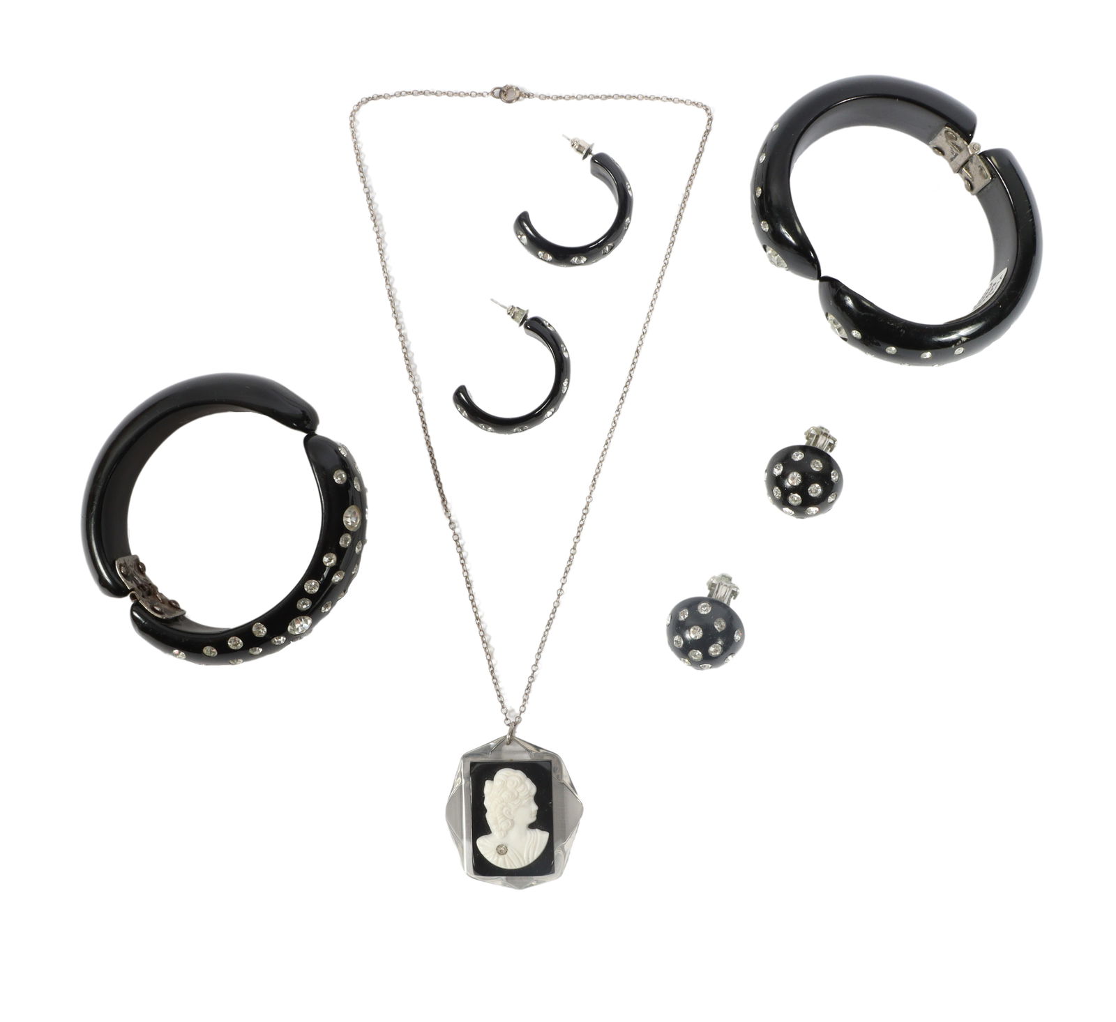 Bakelite and Lucite 5pc group with cameo necklace pendant on sterling silver chain, two clamper: Bakelite and Lucite 5pc group with cameo necklace pendant on sterling silver chain, two clamper bracelets with rhinestones, and two pairs of earrings. 16 5/8"L x 1 5/8"H (Necklace)