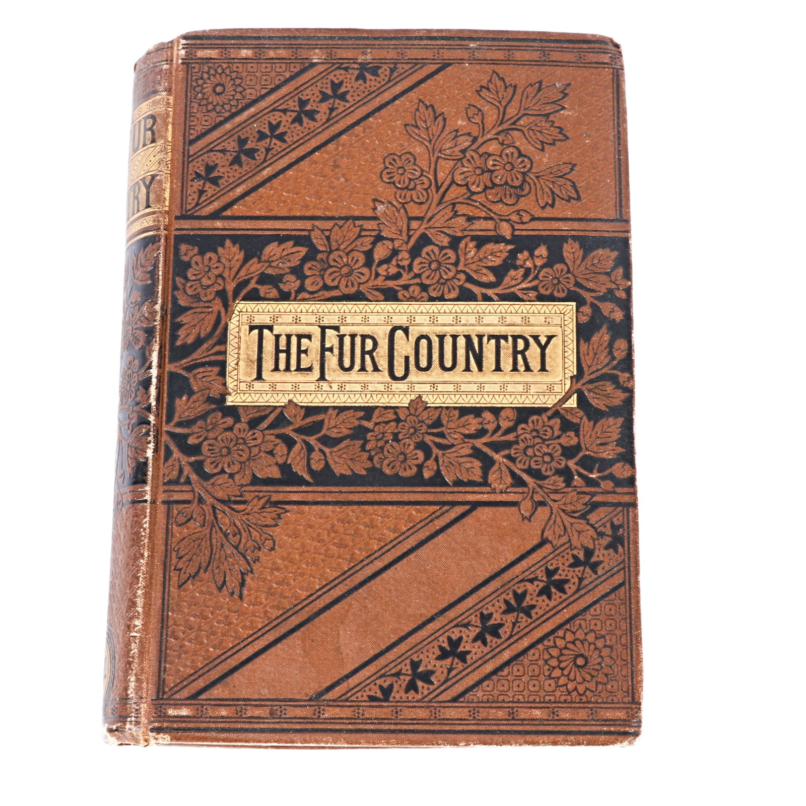 The Fur Country, (Seventy Degrees of Latitude), Jules Verne, John Lovell New York, 1873 7 1/2" x 5": The Fur Country, (Seventy Degrees of Latitude), Jules Verne, John Lovell New York, 1873 Brown leather, gold, embossed. 7 1/2" x 5" x 1 1/4"