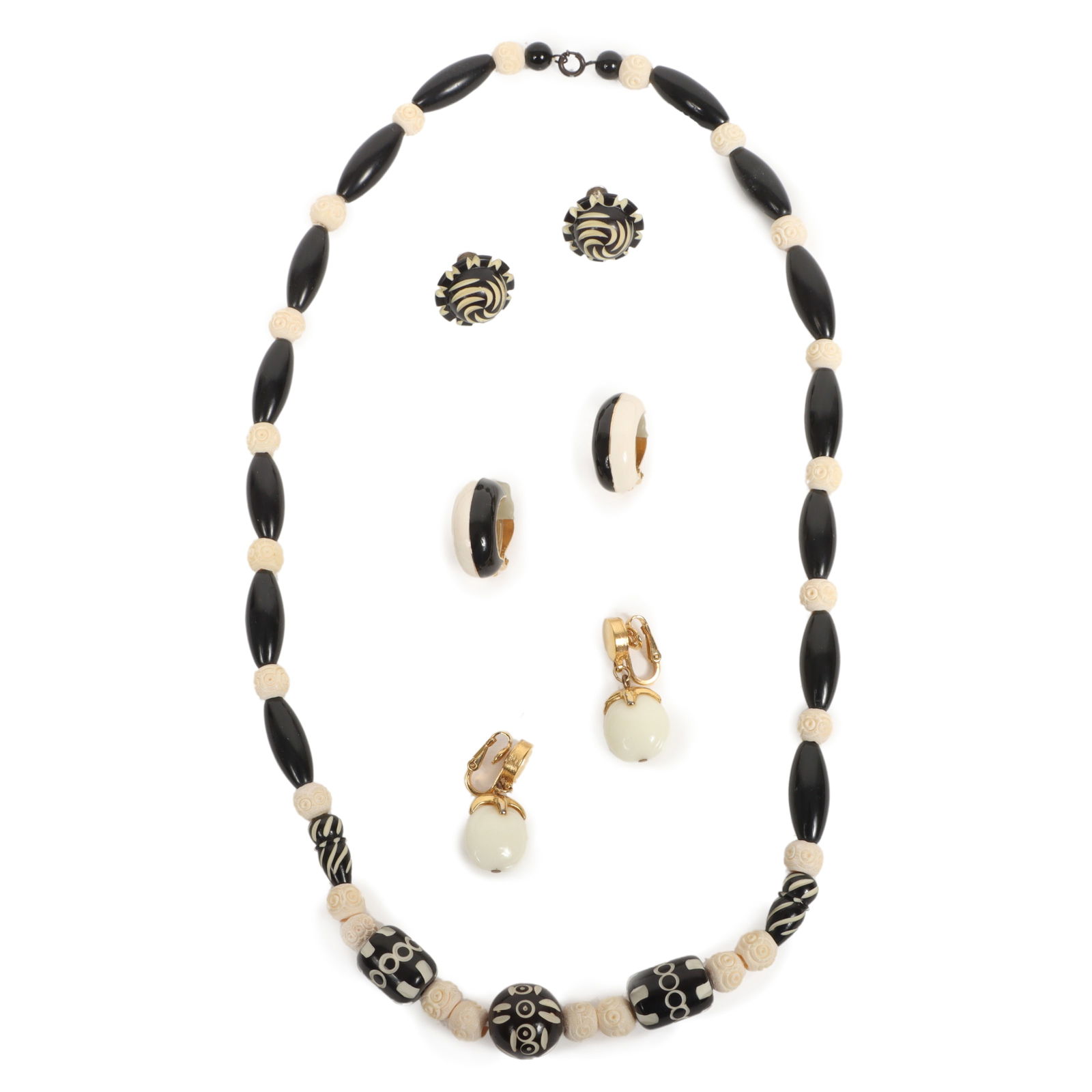 Vintage jewelry 4pc group: Crown Trifari fruit earrings, Ciner enamel earrings, and carved beaded: Vintage jewelry 4pc group: Crown Trifari fruit earrings, Ciner enamel earrings, and carved beaded necklace and earrings. Provenance: From the collection of Cheryl Killmer. 25"L x 3/4"W (necklace)