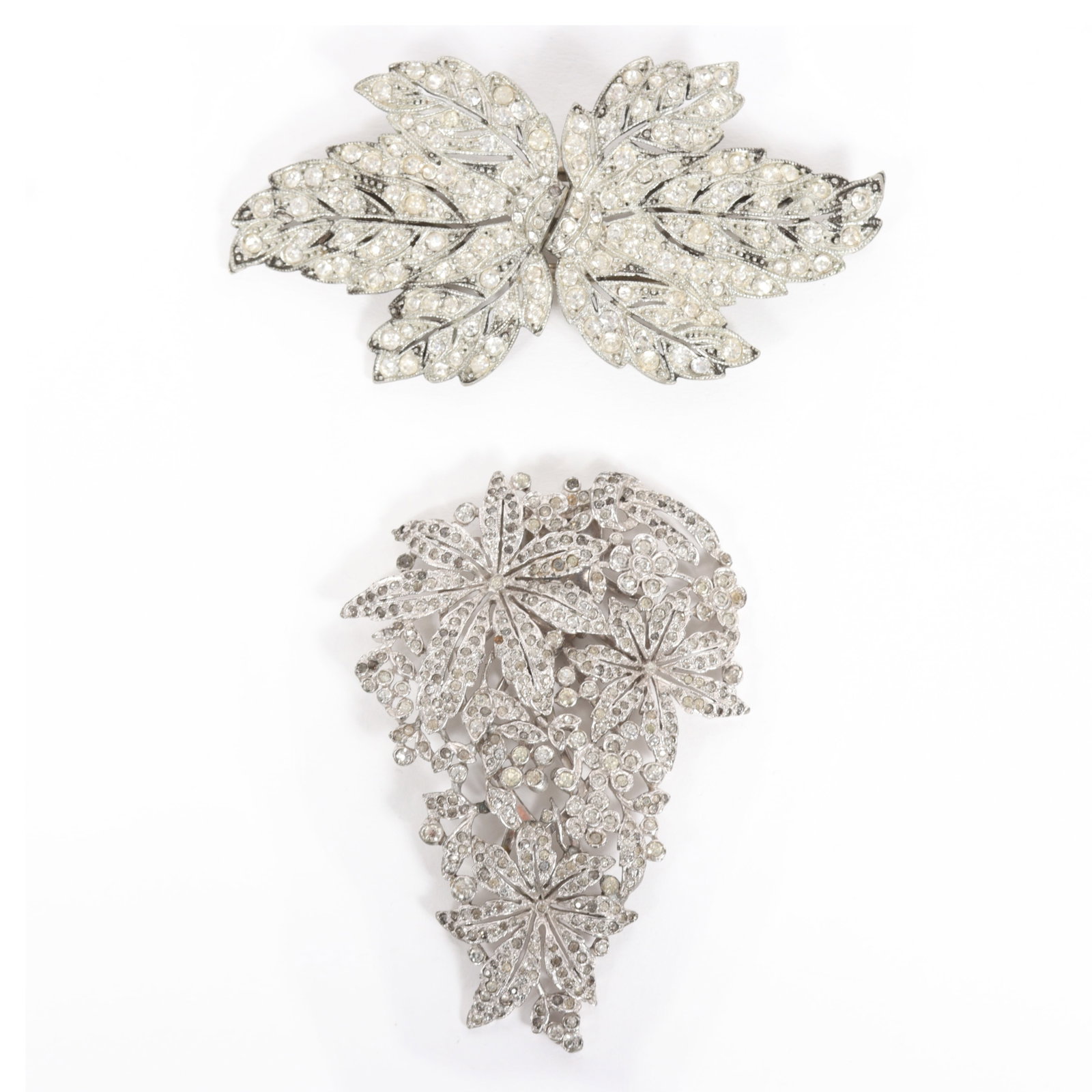 KTF Trifari floral dress clip with rhinestone duette brooch leaf brooch.: KTF Trifari floral dress clip with rhinestone duette brooch leaf brooch. KTF Trifari dress clip has 2 missing rhinestones and solder repairs to the back, duette also has two missing rhinestones. Prove