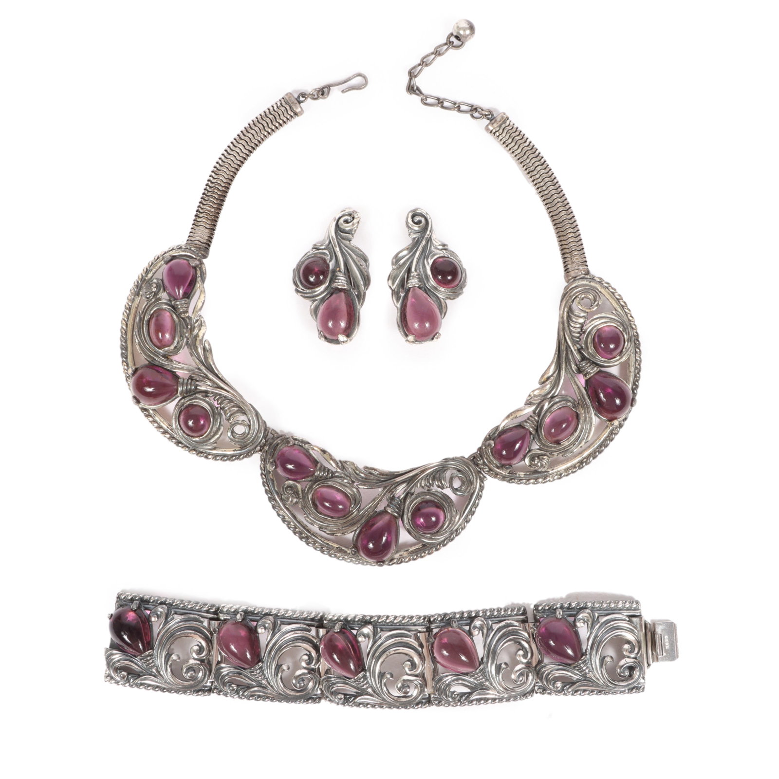 Napier purple stone bib necklace with matching bracelet and earrings.Provenance: From the collection: Napier purple stone bib necklace with matching bracelet and earrings. Provenance: From the collection of Cheryl Killmer. 15"L x 1 1/2"W (necklace)