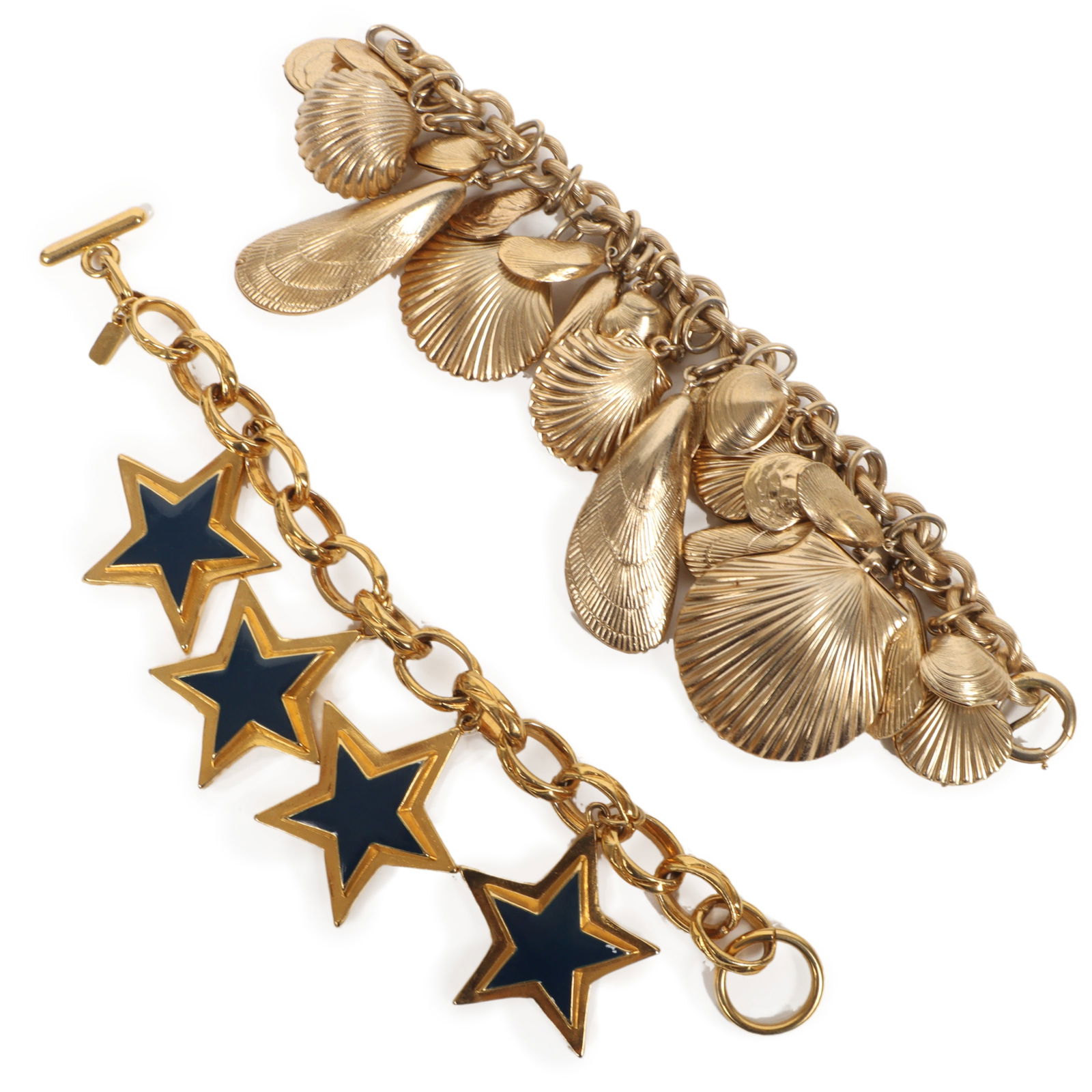 Napier sea shell charm bracelet with Escada star charm bracelet.: Napier sea shell charm bracelet with Escada star charm bracelet. One missing sea shell charm on Napier bracelet. Provenance: From the collection of Cheryl Killmer. 8"L x 2 1/2"W (star bracelet)