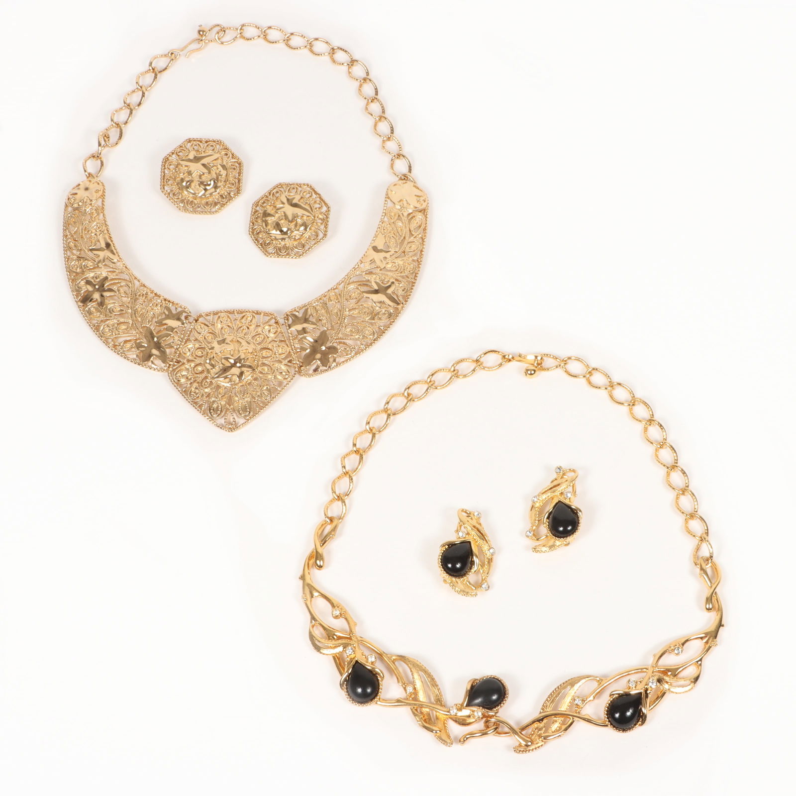 Barrera for Avon 4pc Group Including Gilded Bib Necklace and matching earrings, and black and: Barrera for Avon 4pc Group Including Gilded Bib Necklace and matching earrings, and black and rhinestone Granada necklace with matching earrings. Provenance: From the collection of Cheryl Killmer. 15