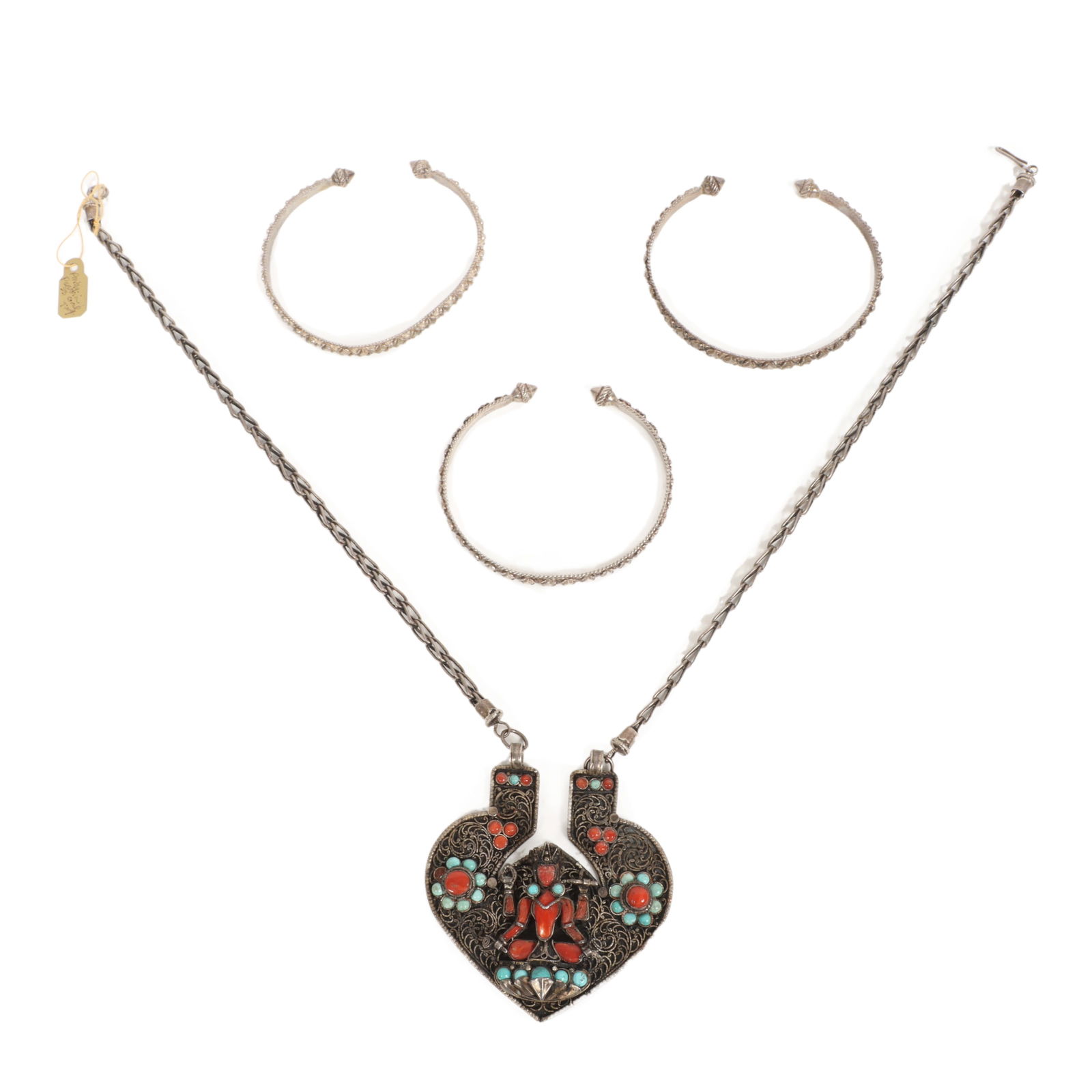 Nepalese sterling silver coral and turquoise deity Goddess filigree pendant necklace and three: Nepalese sterling silver coral and turquoise deity Goddess filigree pendant necklace and three sterling silver cuff bracelets. One bracelet is out of round. One stone missing from necklace. 20 1/4" L