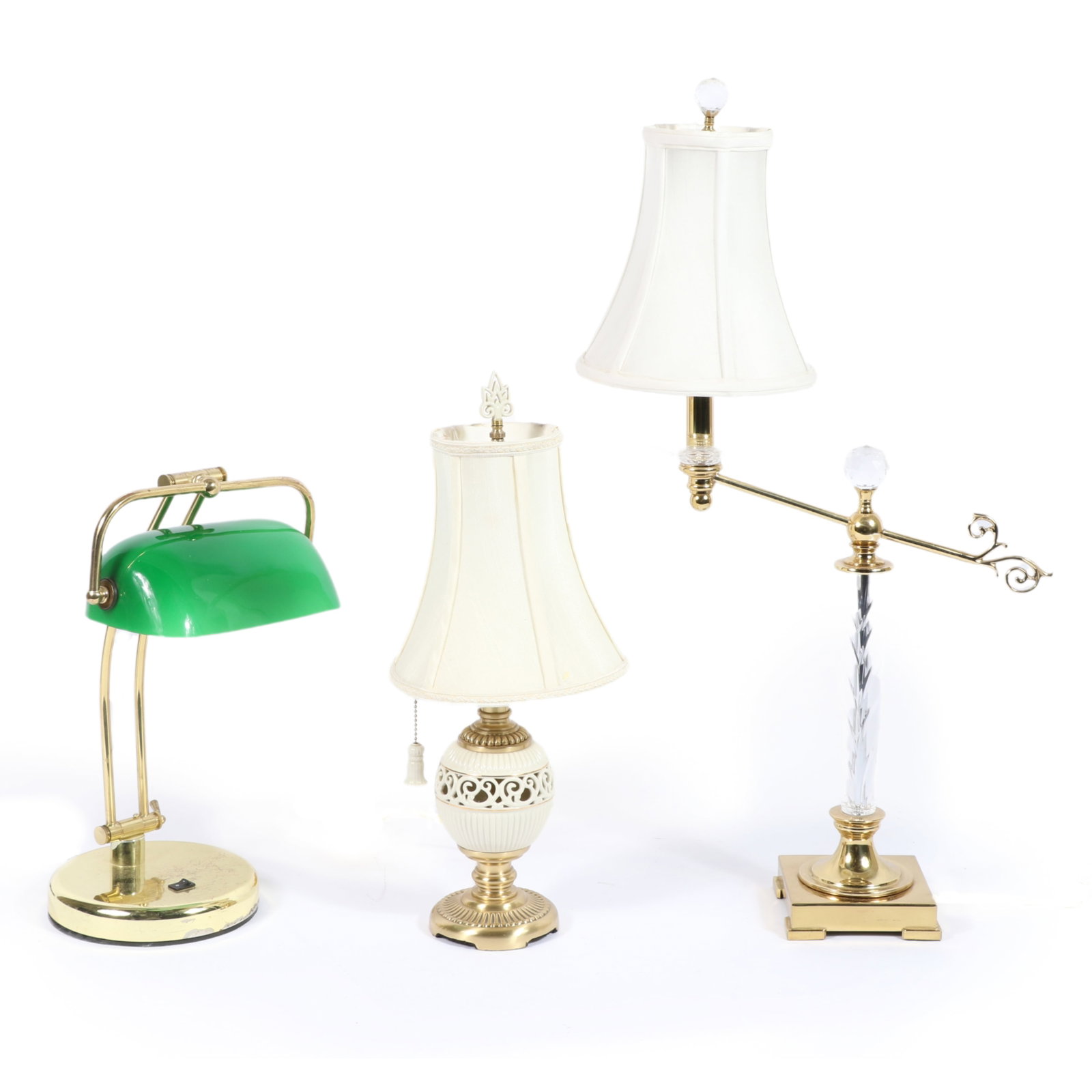 Lot of 3 brass table lamps: Banker's desk lamp with green glass shade, Lenox Quoizele lamp with: Lot of 3 brass table lamps: Banker's desk lamp with green glass shade, Lenox Quoizele lamp with pierced porcelain body and finial, Lenox Quoizele extended arm lamp with cut crystal body and two facete