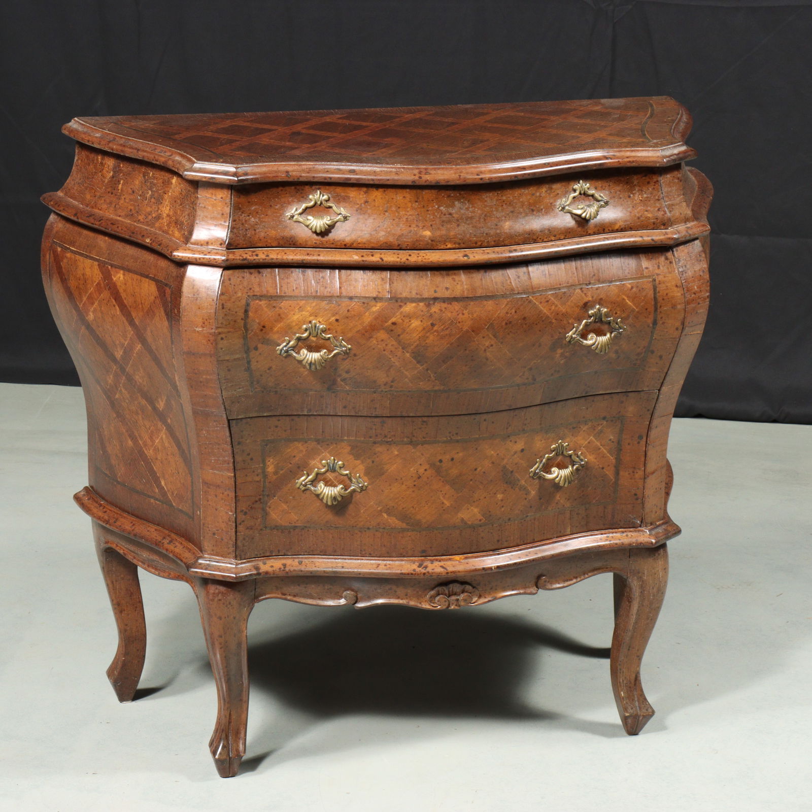Italian Louis XV style three drawer inlaid veneer parquetry bombe commode chest. 28"H x 31 1/4"W: Italian Louis XV style three drawer inlaid veneer parquetry bombe commode chest. 28"H x 31 1/4"W