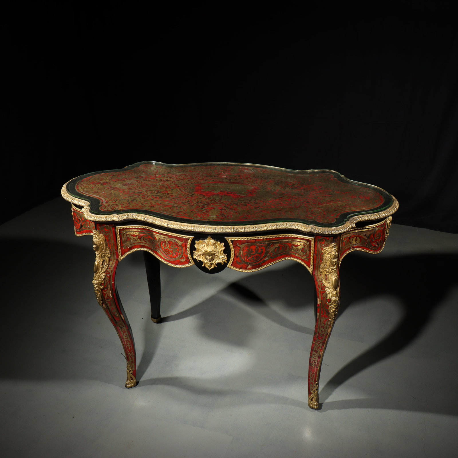 French Louis XV ormolu mounted ebonized boulle salon table. 32"H x 30"D x 52"W: French Louis XV ormolu mounted ebonized boulle salon table. Some restoration needed to metalwork. 32"H x 30"D x 52"W
