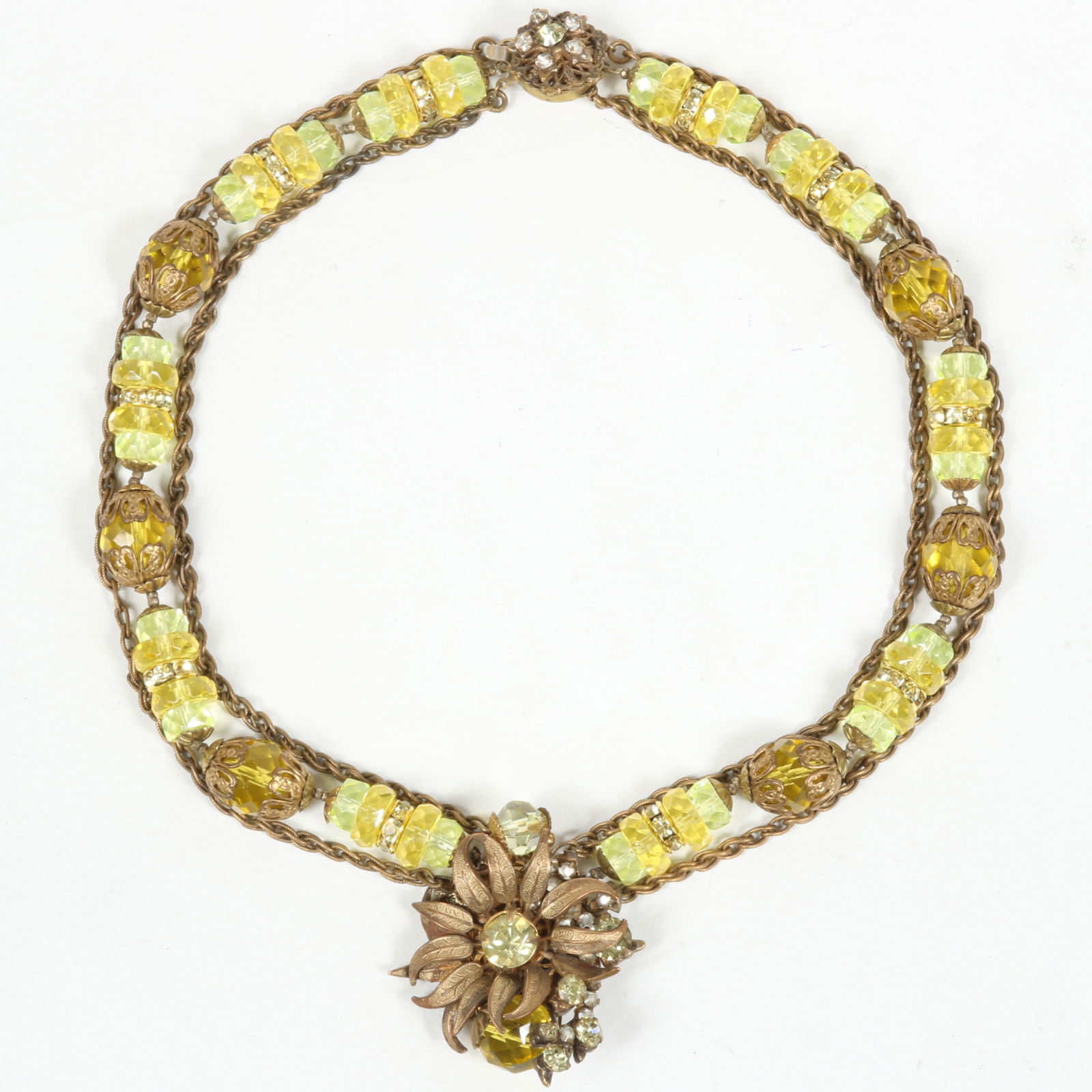 Miriam Haskell bright green and yellow faceted glass disk and double chain necklace with floral: Miriam Haskell bright green and yellow faceted glass disk and double chain necklace with floral pendant. 15"L x 1 7/8"