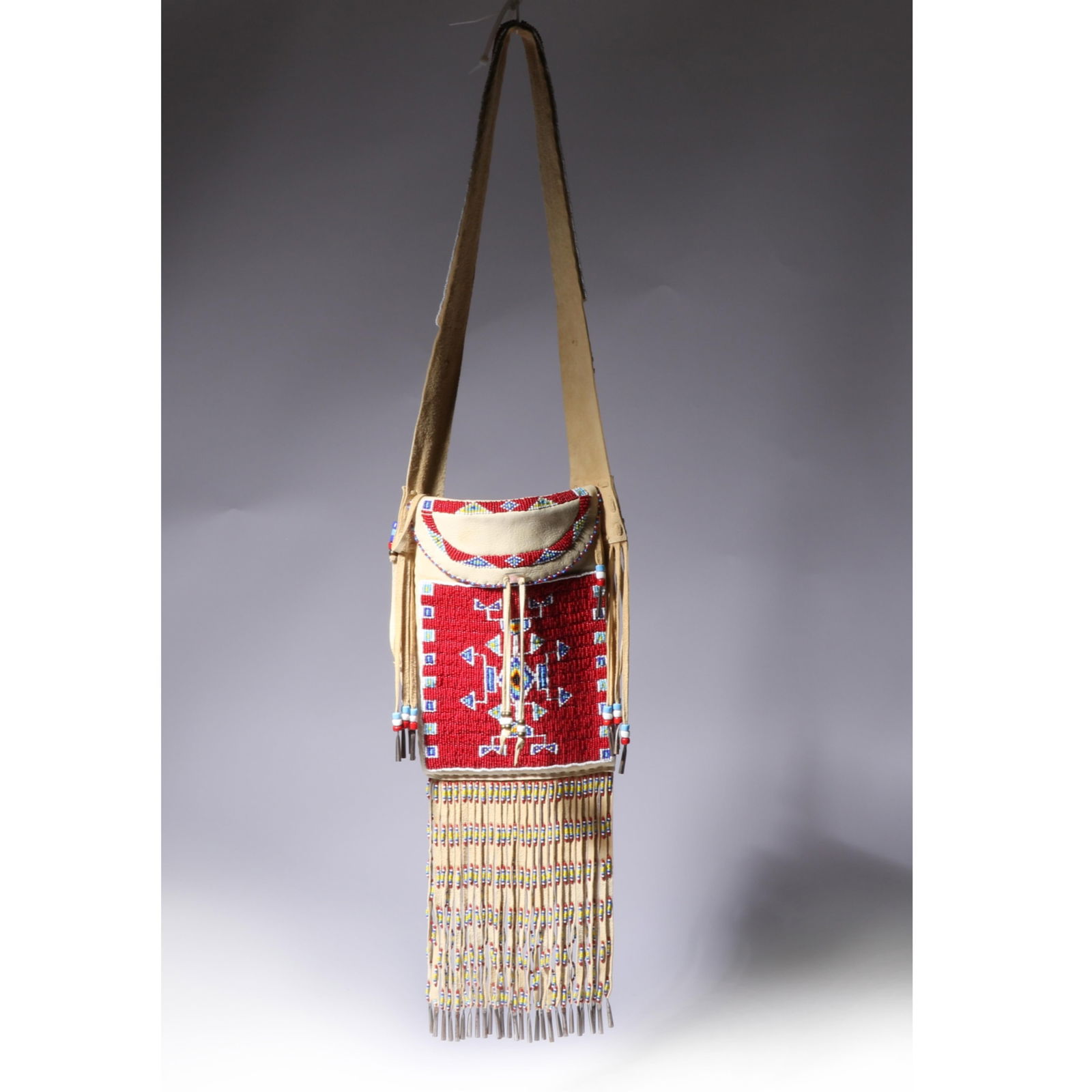 Douglas Fast Horse, Oglala Lakota Leather and Beaded bag with Fringe 8"H x 11 1/4"W (body); 42"H (1 of 13)