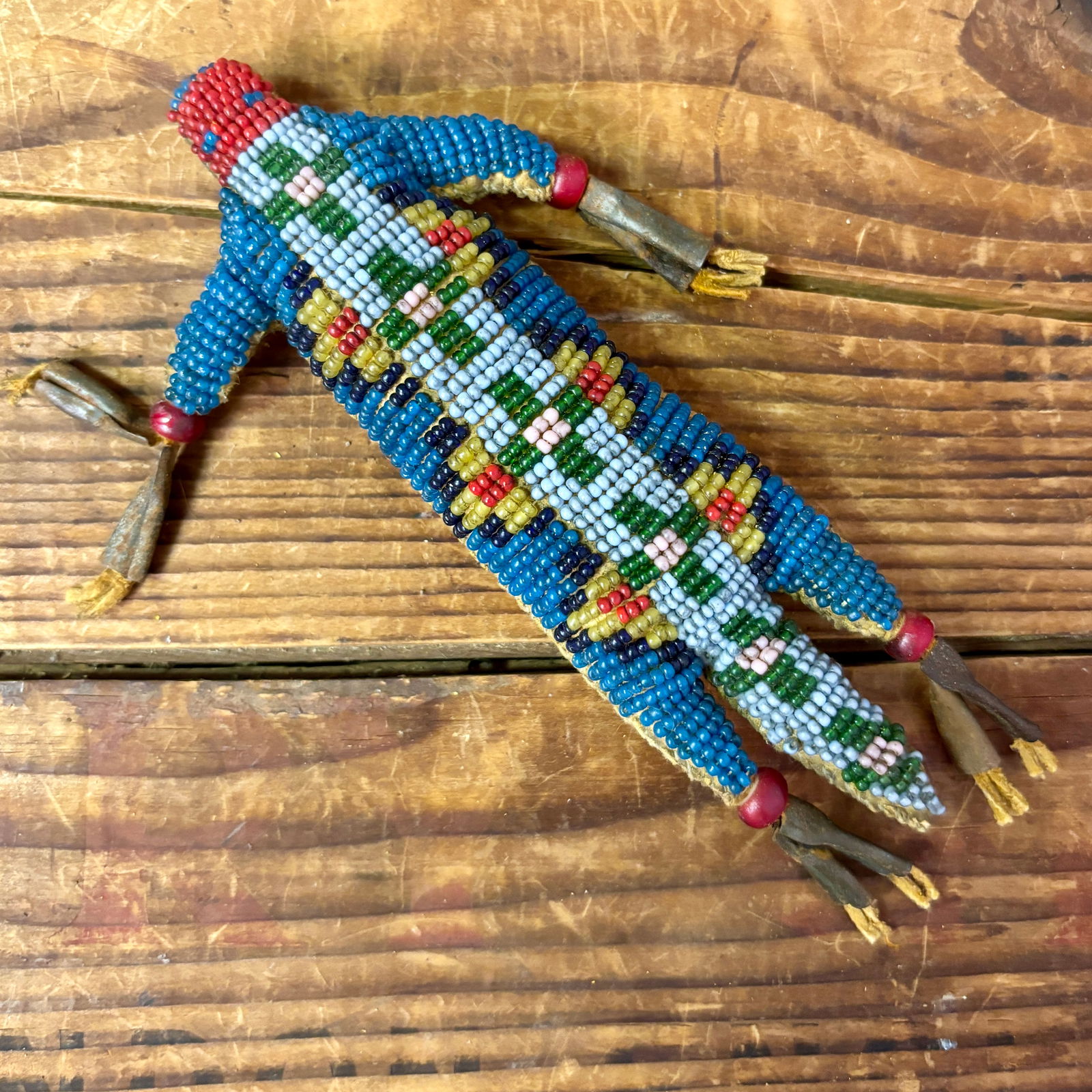 Northern Plains Beaded Lizard Umbilical Fetish, ca. mid 1900s 6 1/4" long x 3 1/4" wide x 1/2" deep (1 of 3)