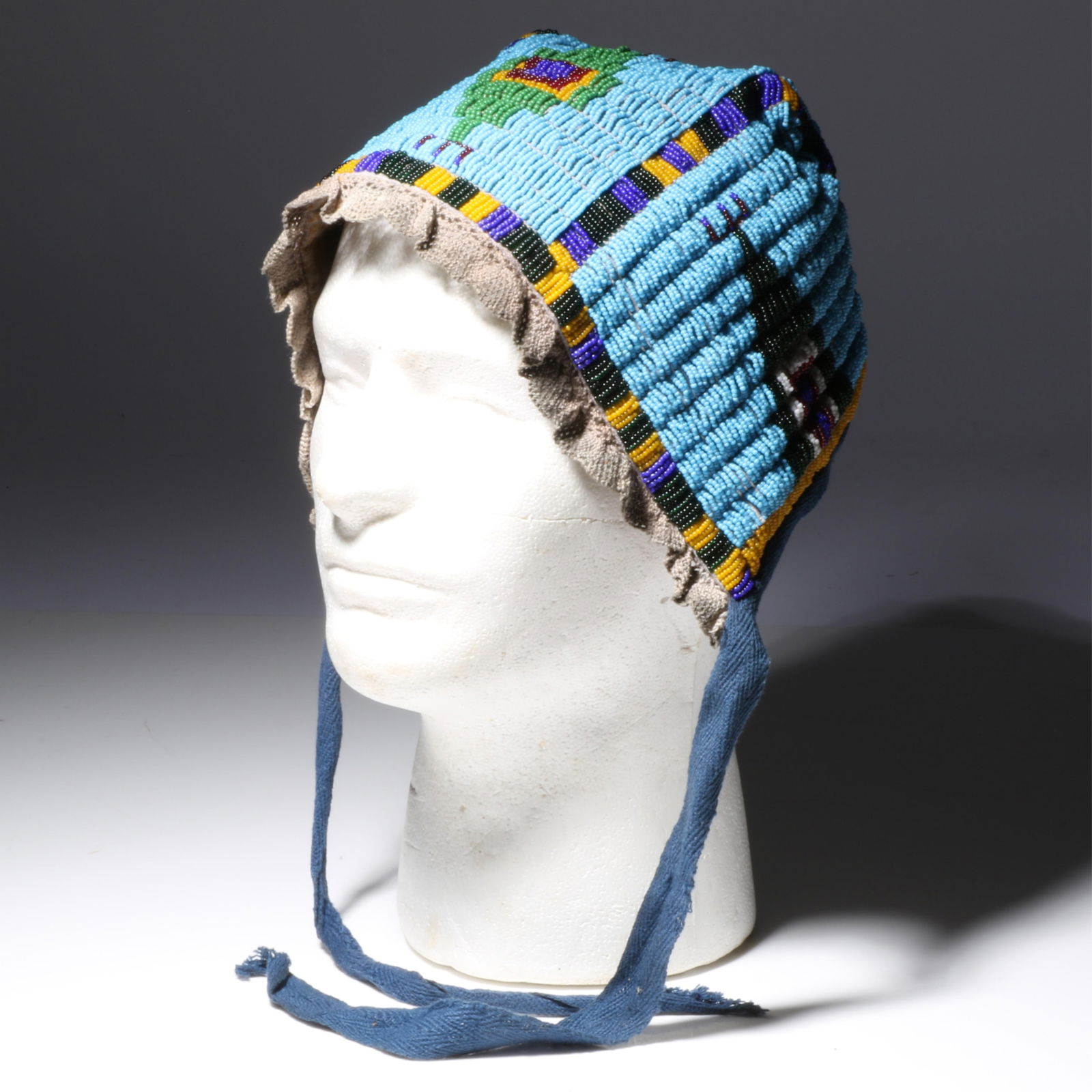 Northern Plains Fully Beaded Fabric Bonnet, ca. early 1900s 6" high x 5 1/4" wide x 6 1/4" deep (1 of 10)