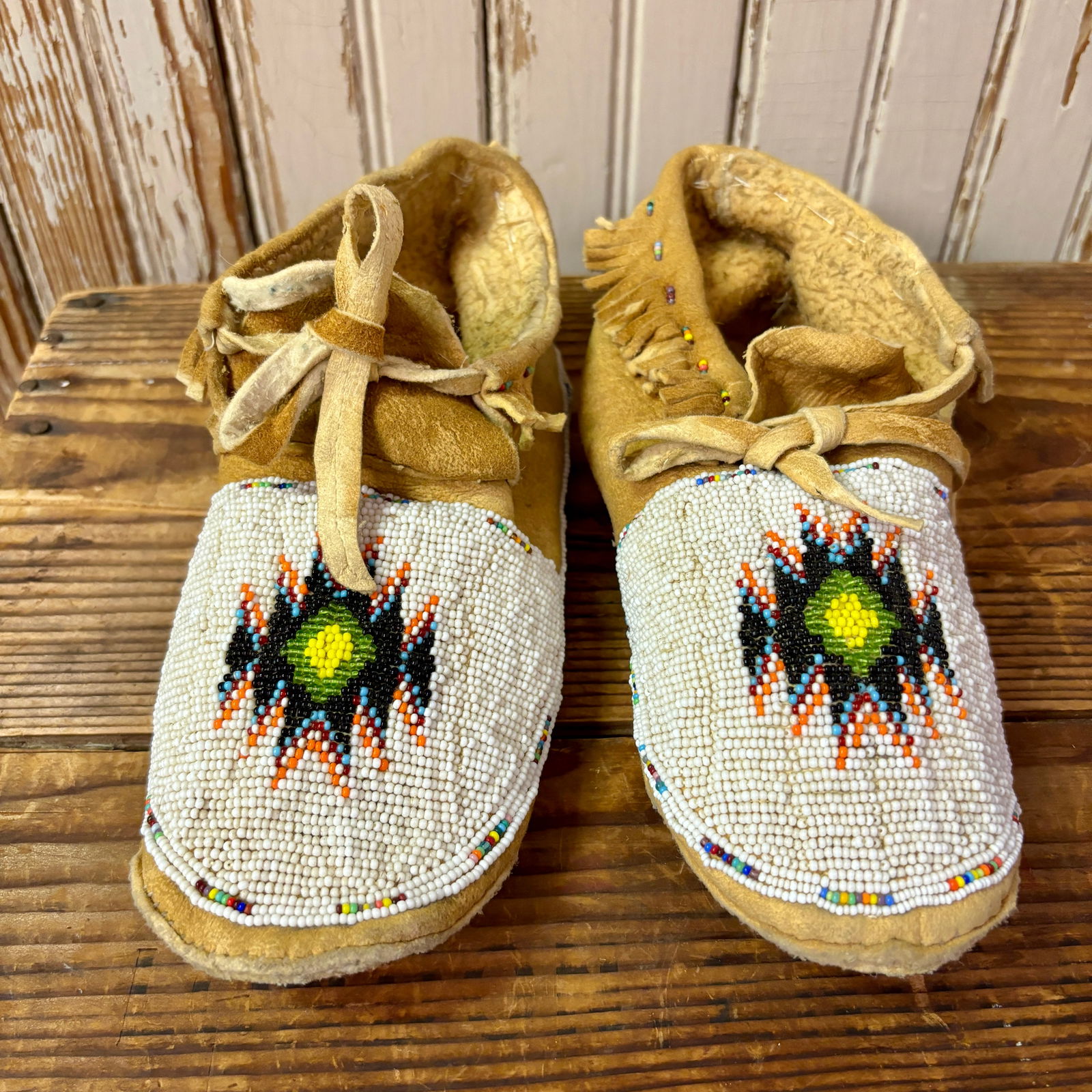 Northern Plains Flat-style Beaded Leather Moccasins, ca. mid 1900s 8 1/2" long x 3" wide x 3" high (1 of 6)