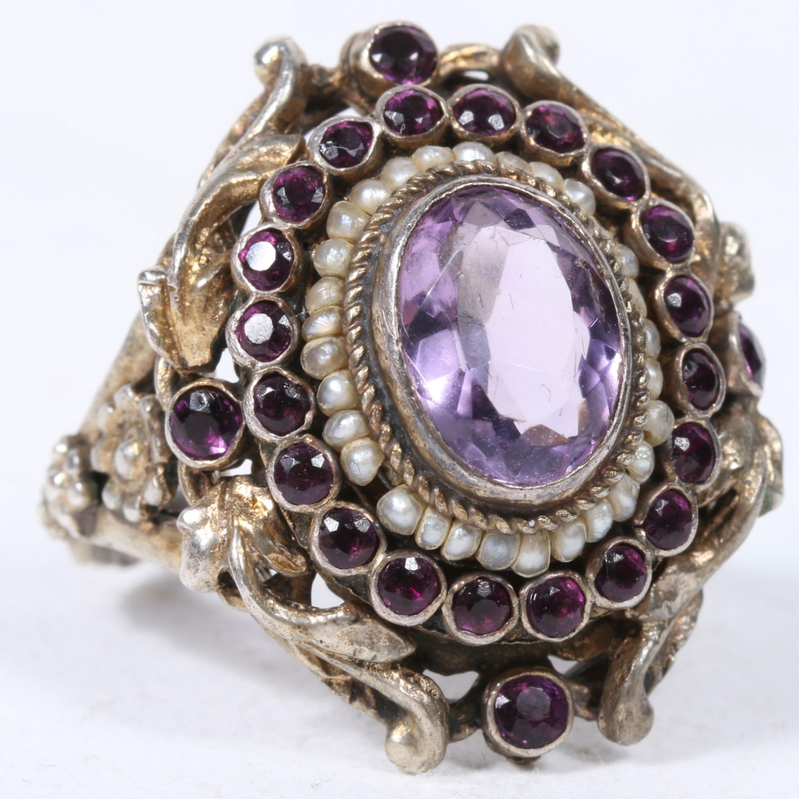 Antique Victorian Austro-Hungarian ornate floral ring with faceted amethyst center surrounded by (1 of 7)