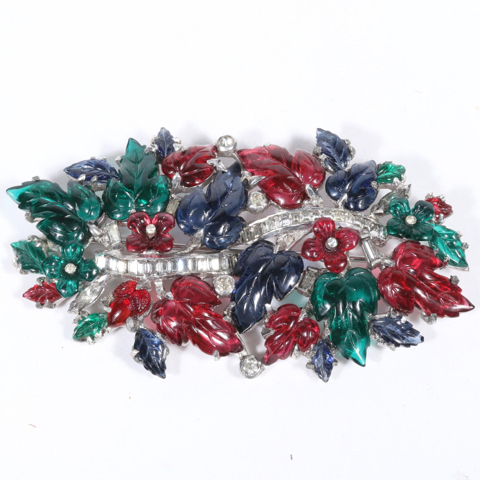 Unsigned Mazer? Jewels of Fantasy tri color molded glass foliage and florals brooch with channel set: Unsigned Mazer? Jewels of Fantasy tri color molded glass foliage and florals brooch with channel set rhinestone crystals Some leaves and flowers loose in settings. One replaced leaf for red glass frui