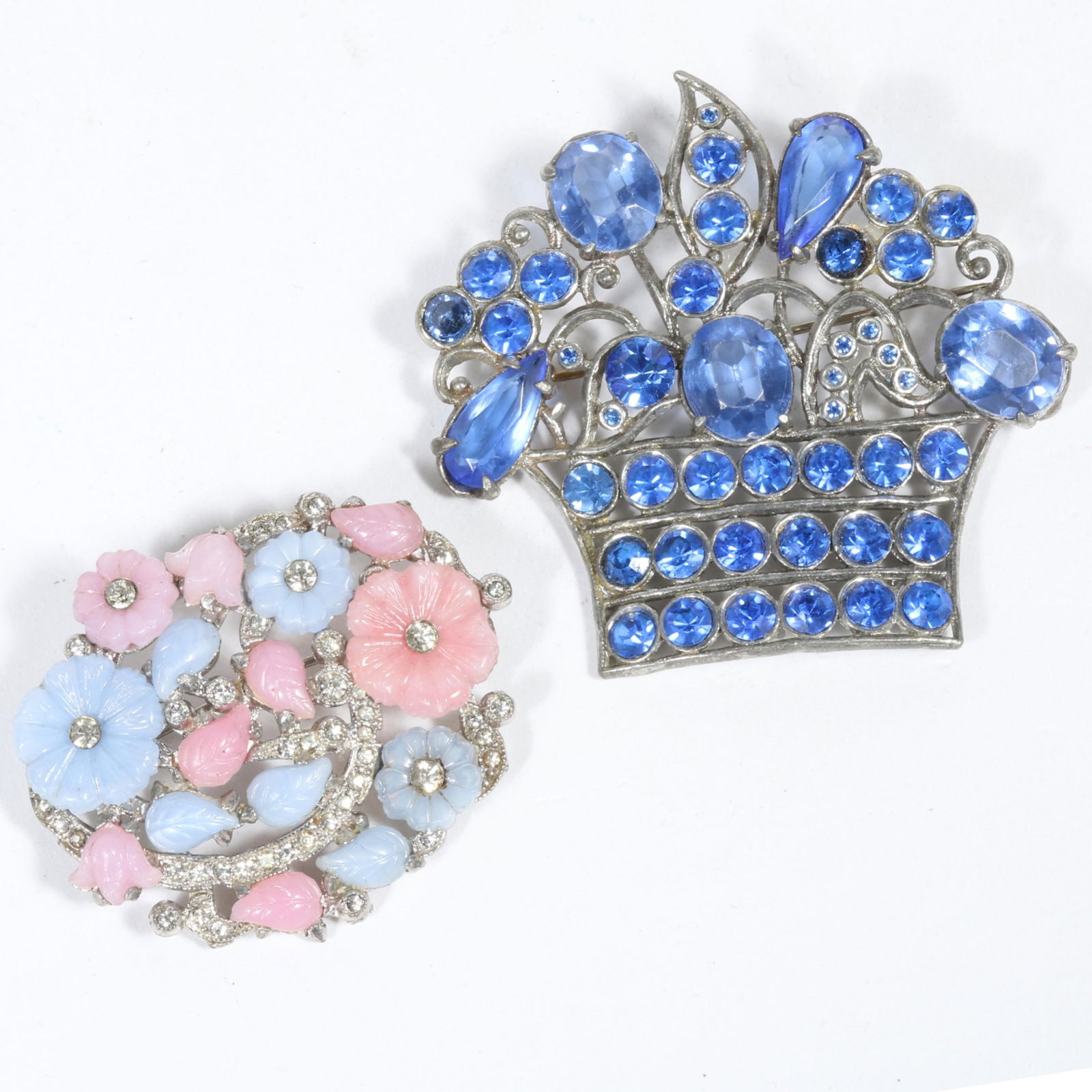 Unsigned Mazer? brooch with molded pastel colored glass flowers and clear rhinestone crystals with: Unsigned Mazer? brooch with molded pastel colored glass flowers and clear rhinestone crystals with Czech pot metal light blue jeweled flower basket brooch. Some pastel flowers loose in their settings.